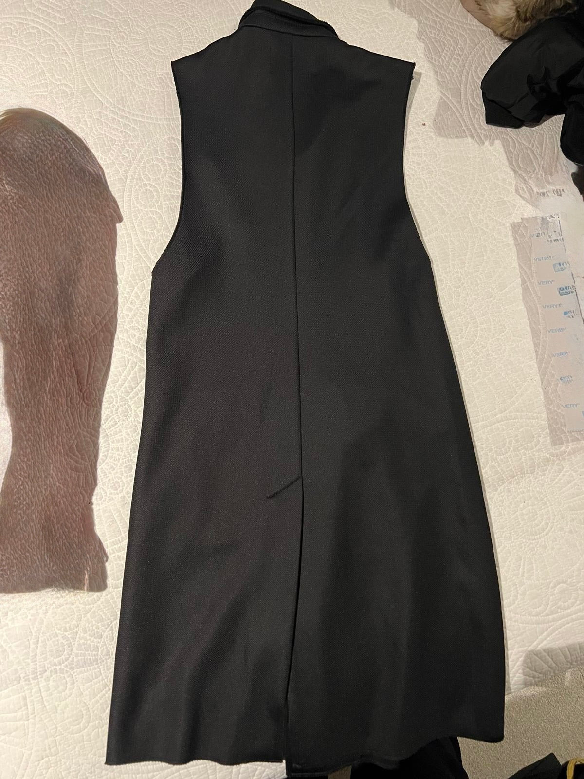 Black, long, sleeveless blazer