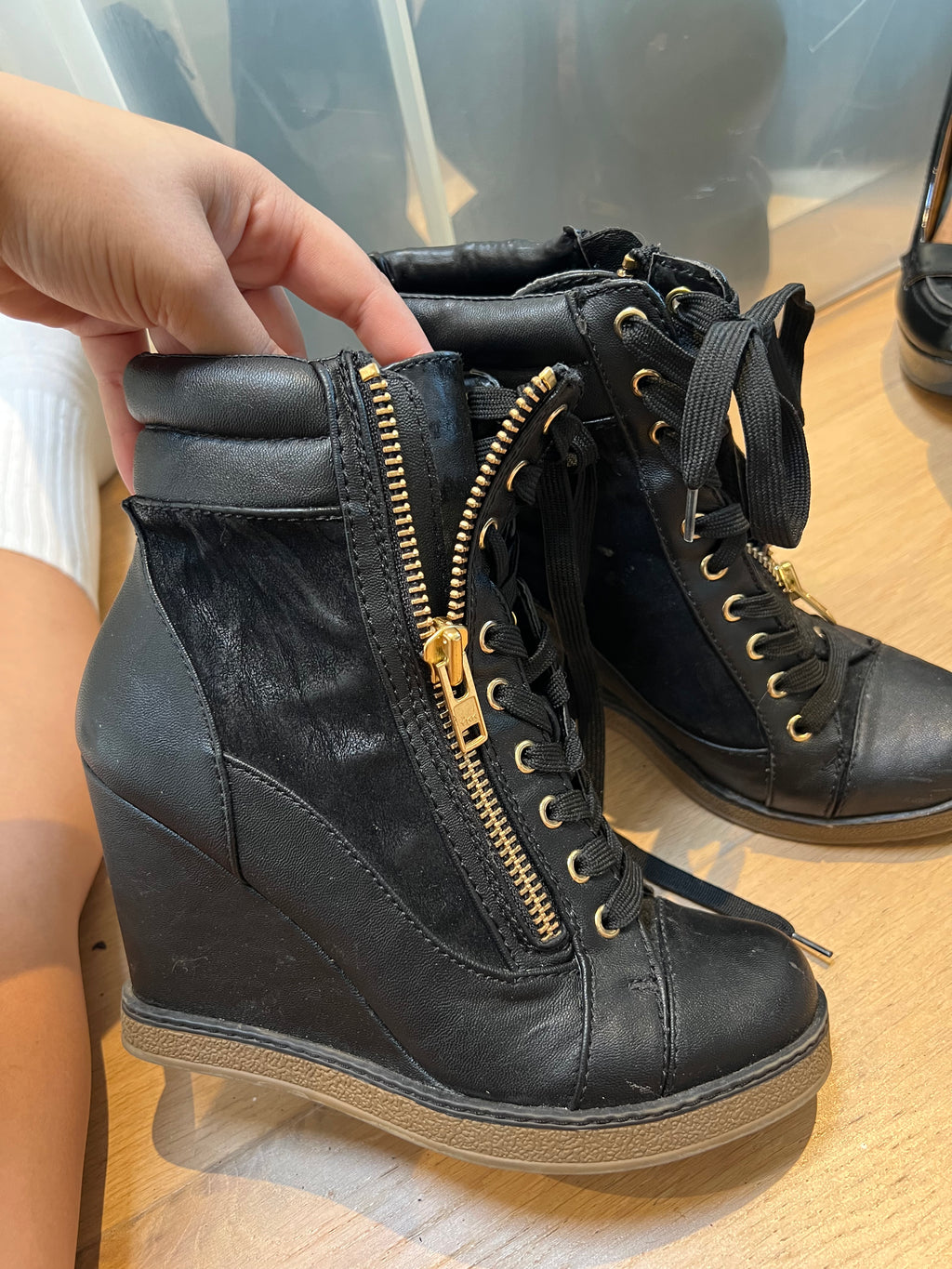 Black wedge heel trainers