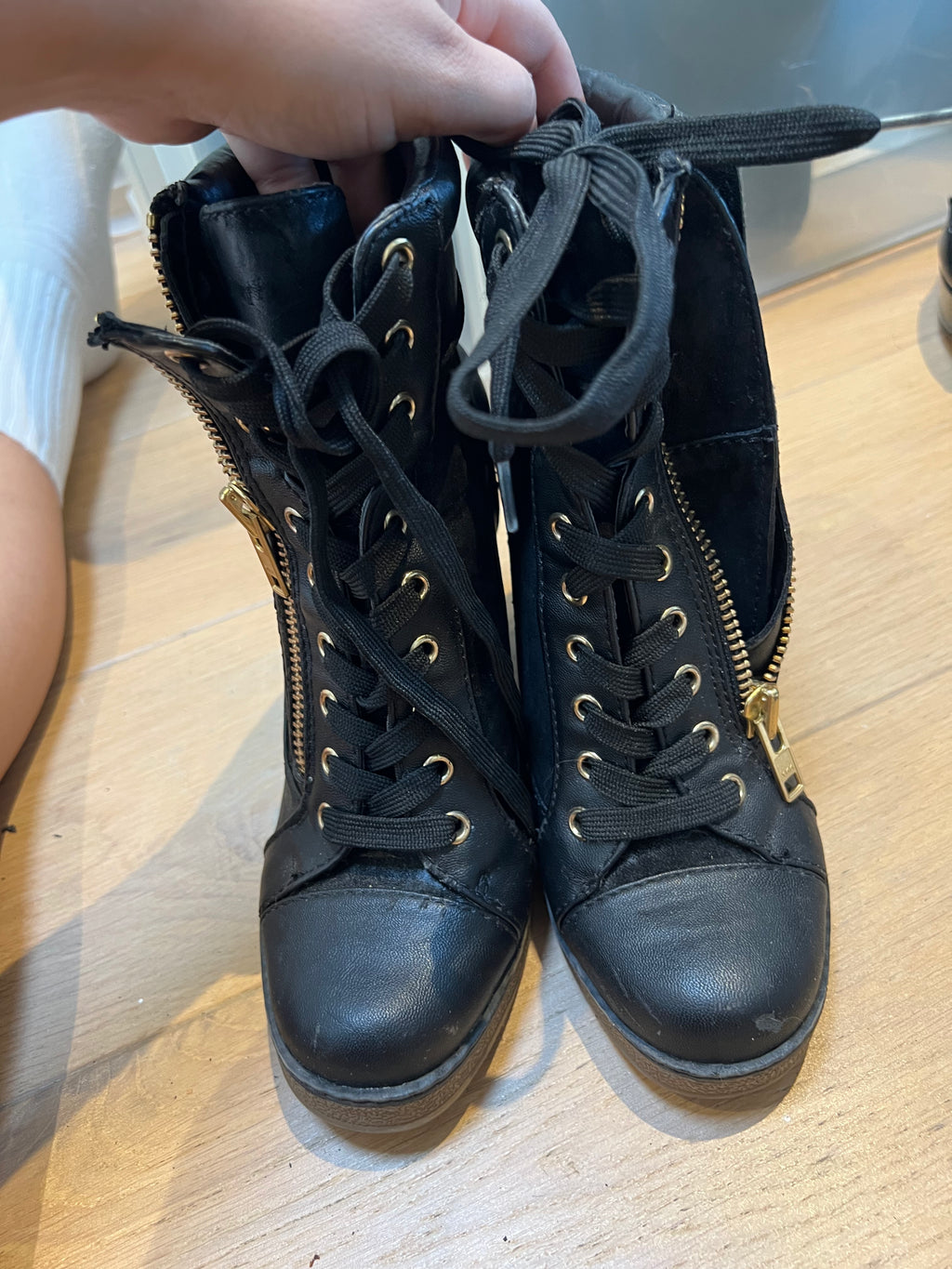Black wedge heel trainers