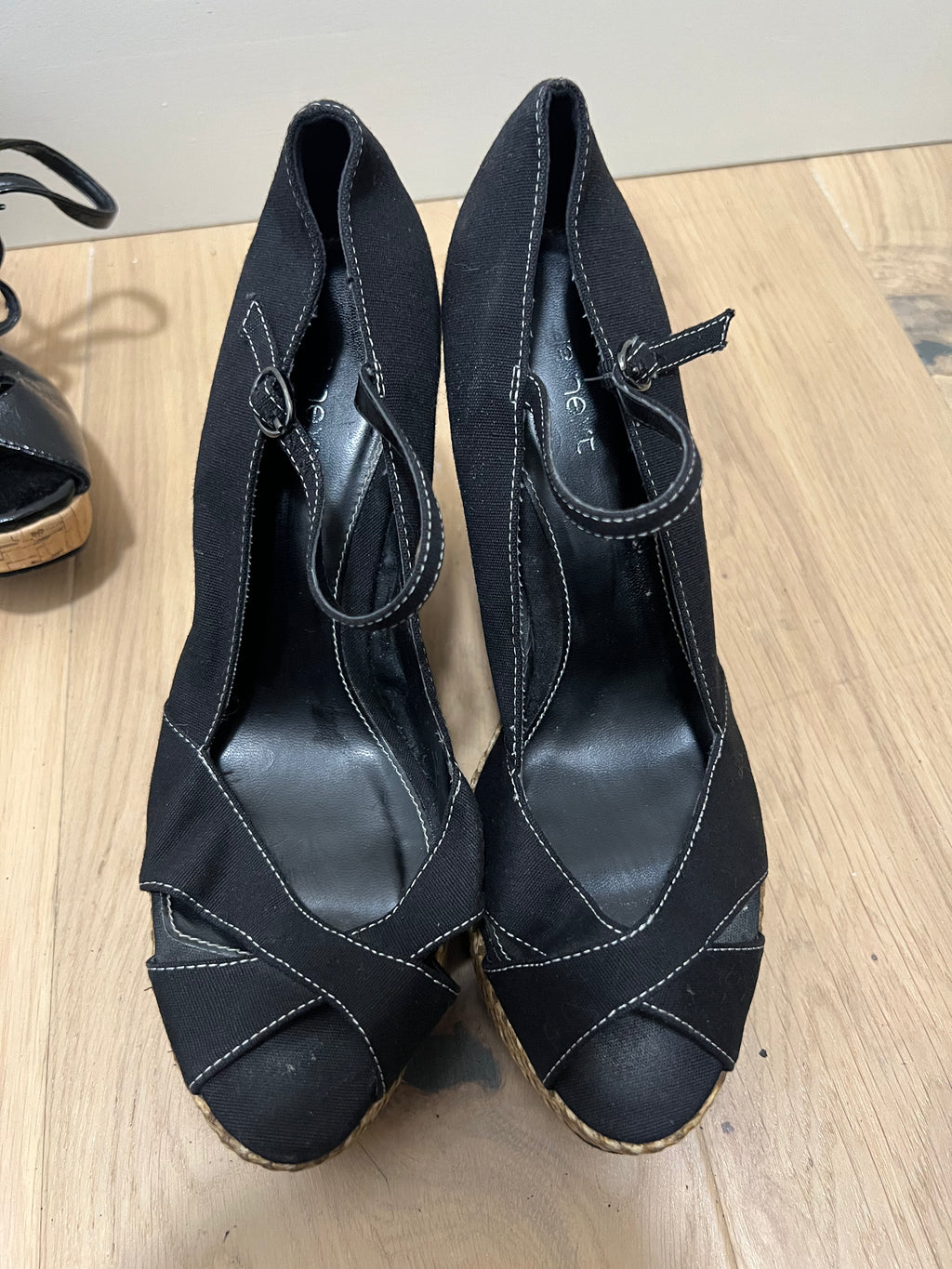 Black heels with woven wedge