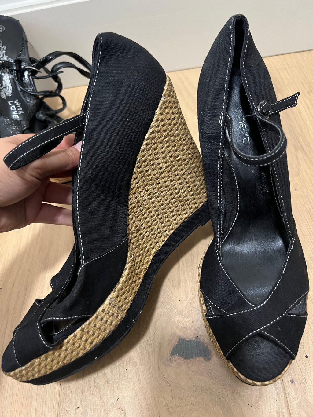Black heels with woven wedge
