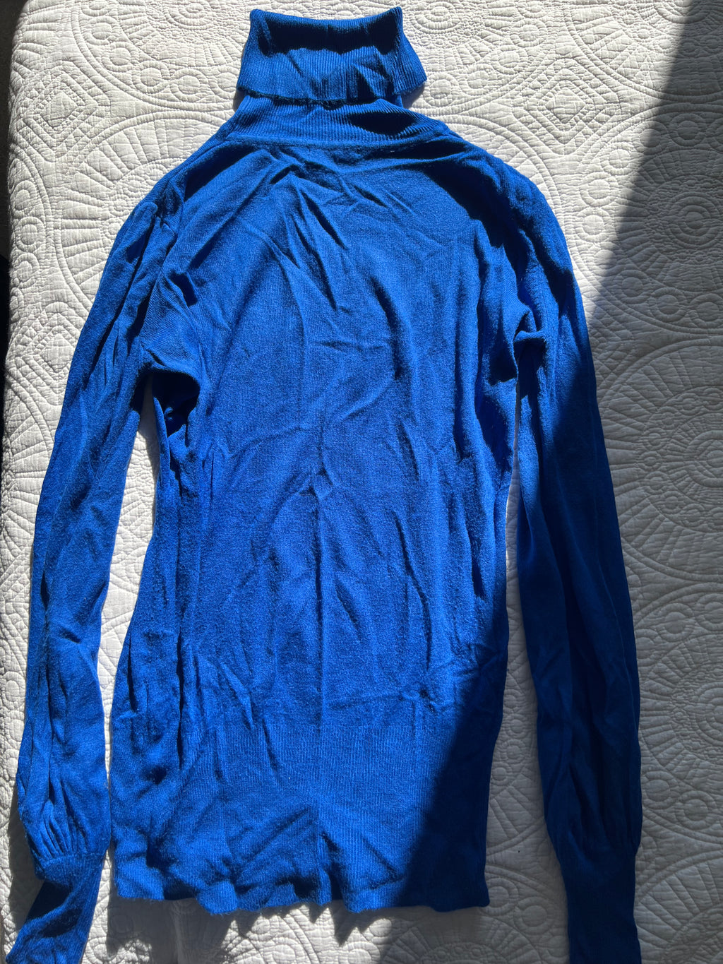 Blue knitted turtleneck top