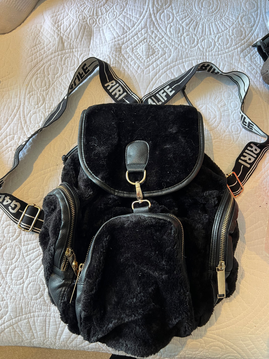 Black backpack, fur detail