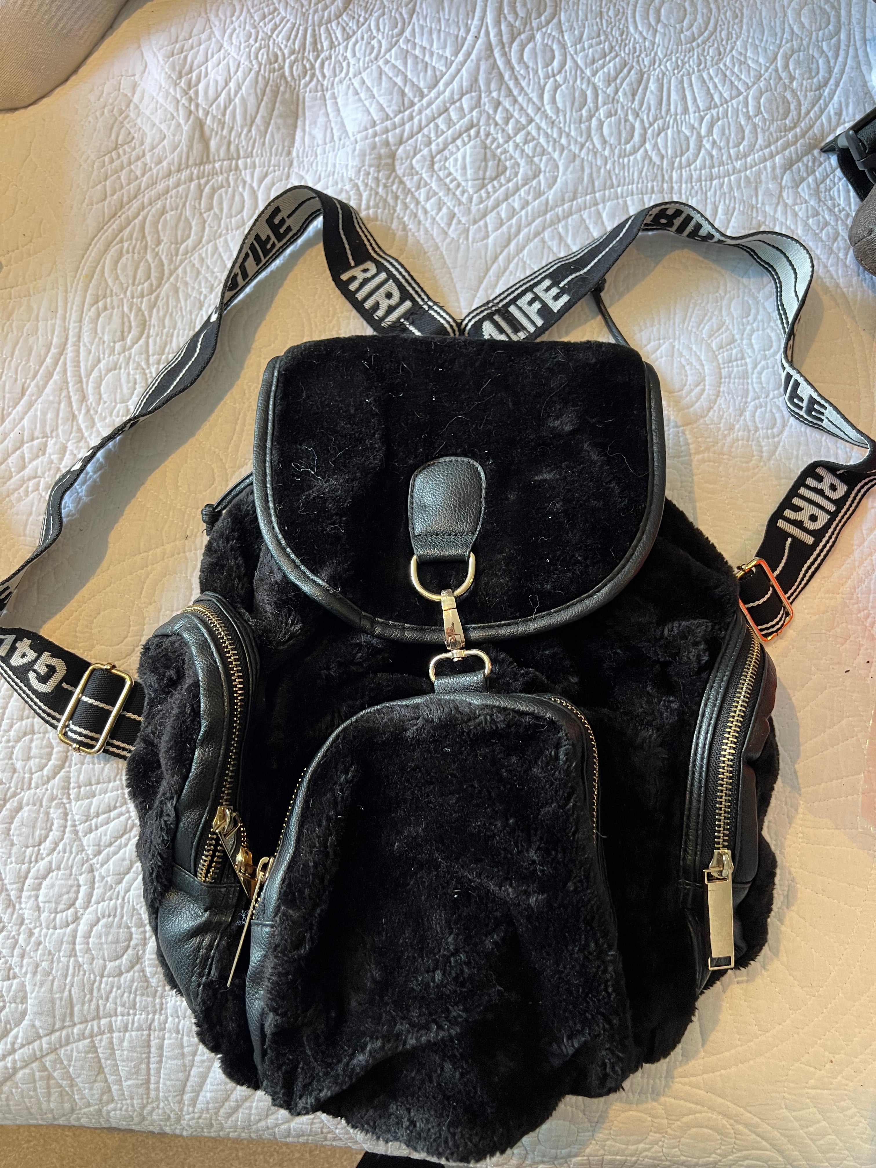 Black backpack, fur detail