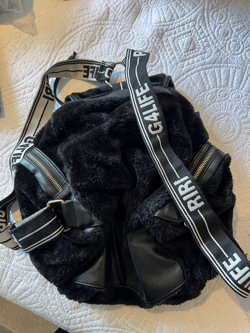 Black backpack, fur detail