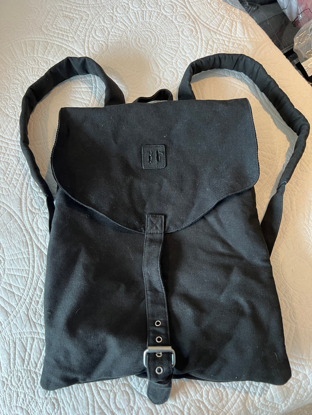 Black sachel backpack, fabric material
