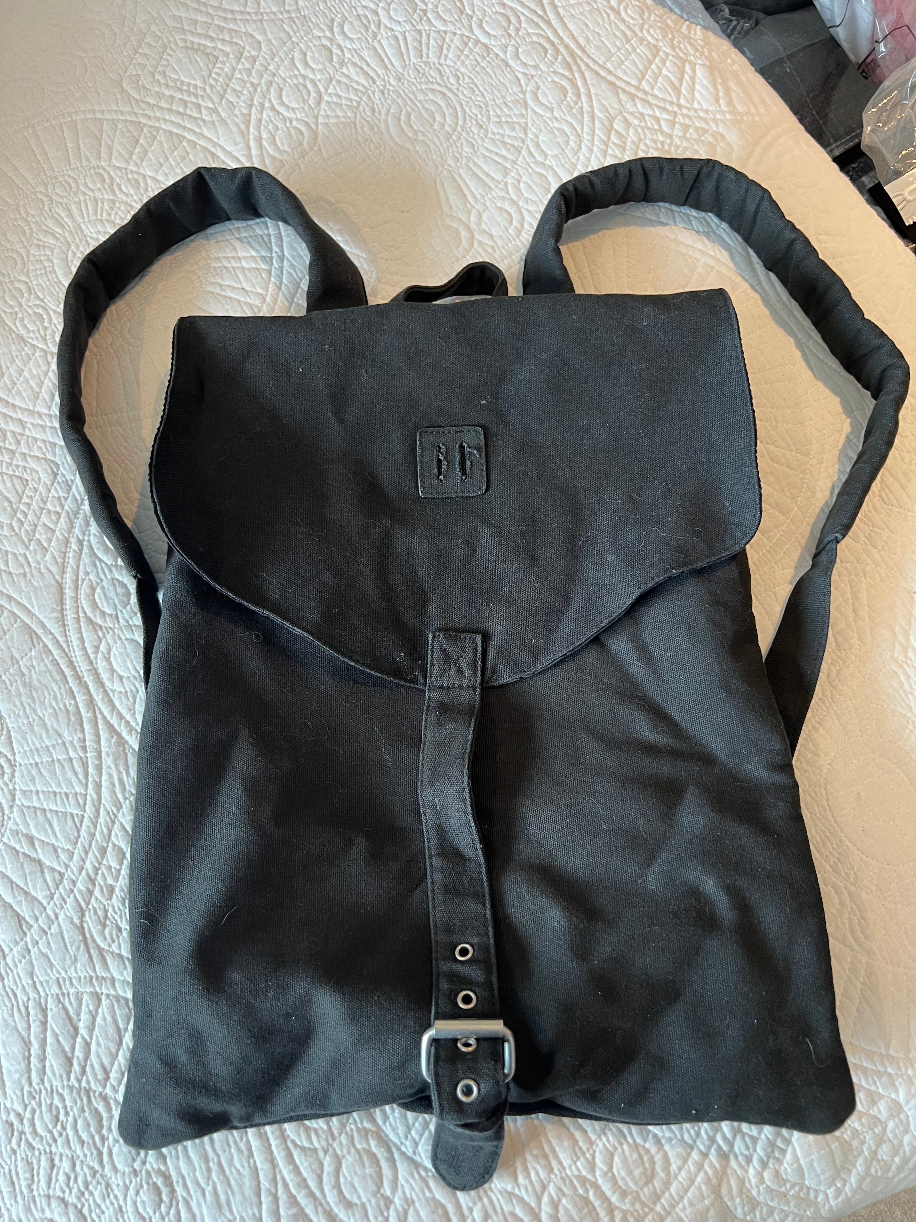 Black sachel backpack, fabric material