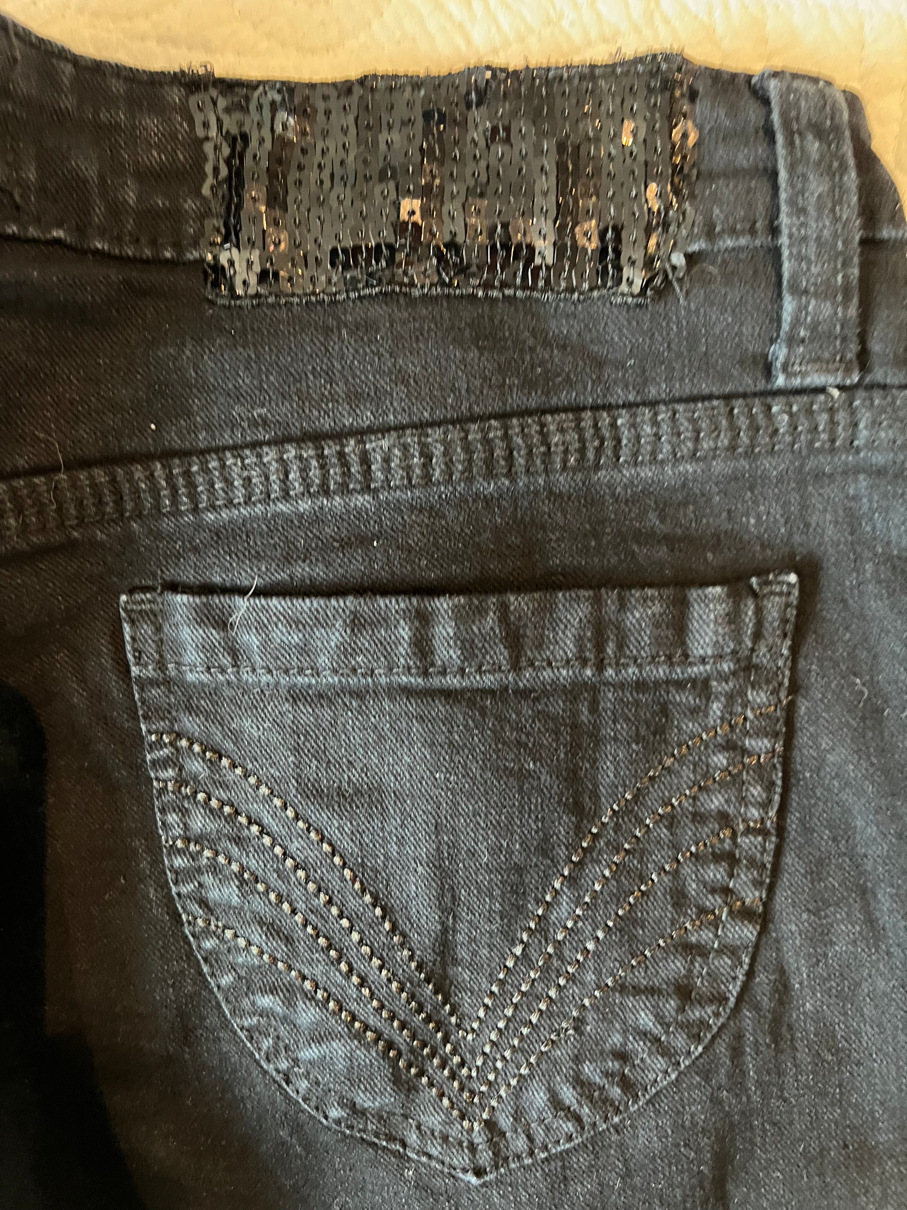 Low rise black jeans / straight leg / sequin feature on back
