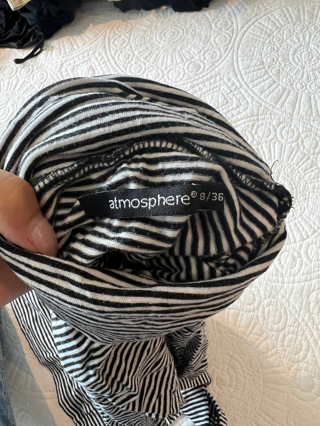 Black and white stripy turtle neck top