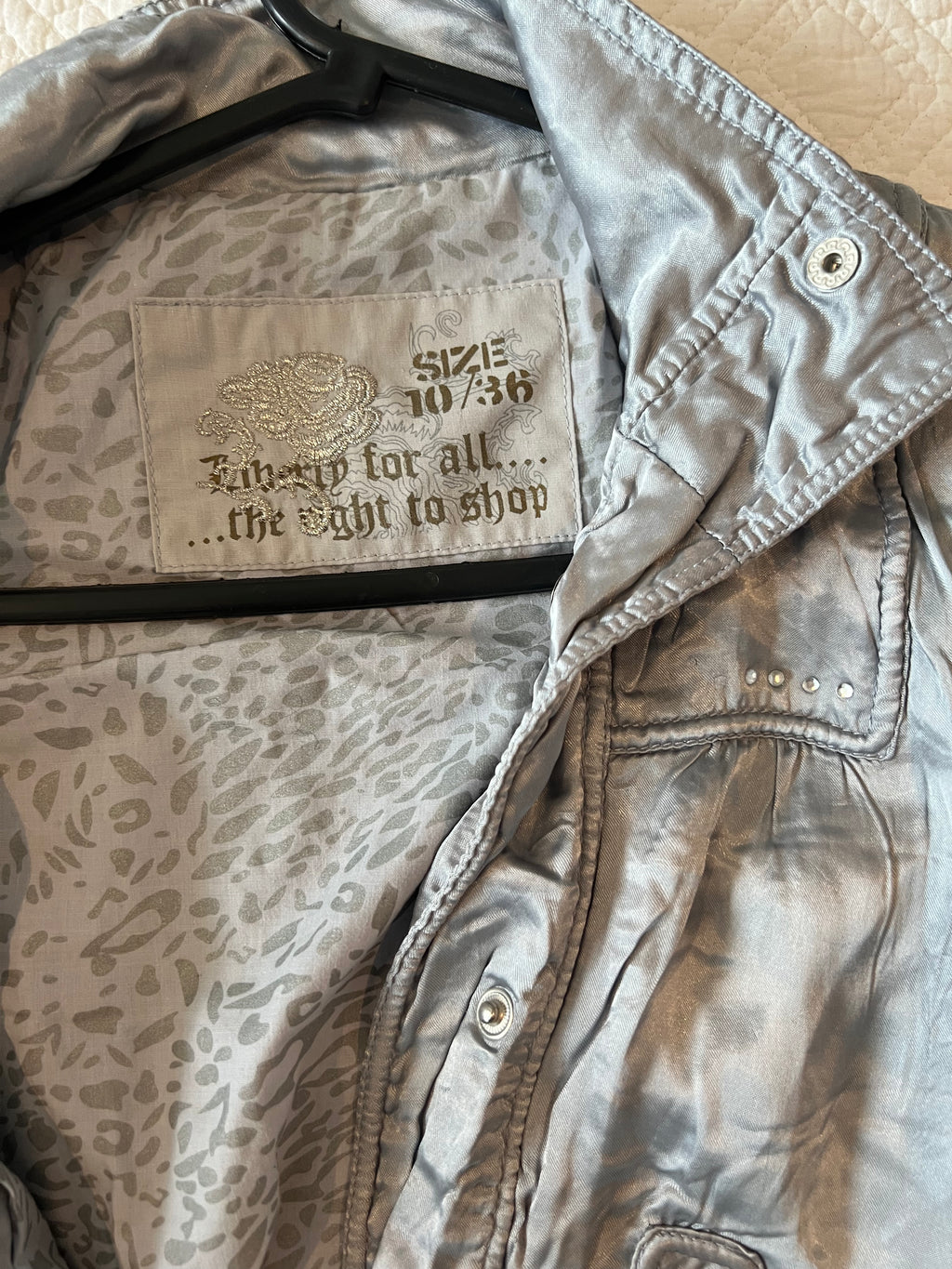 Silver jacket / thin stain effect material