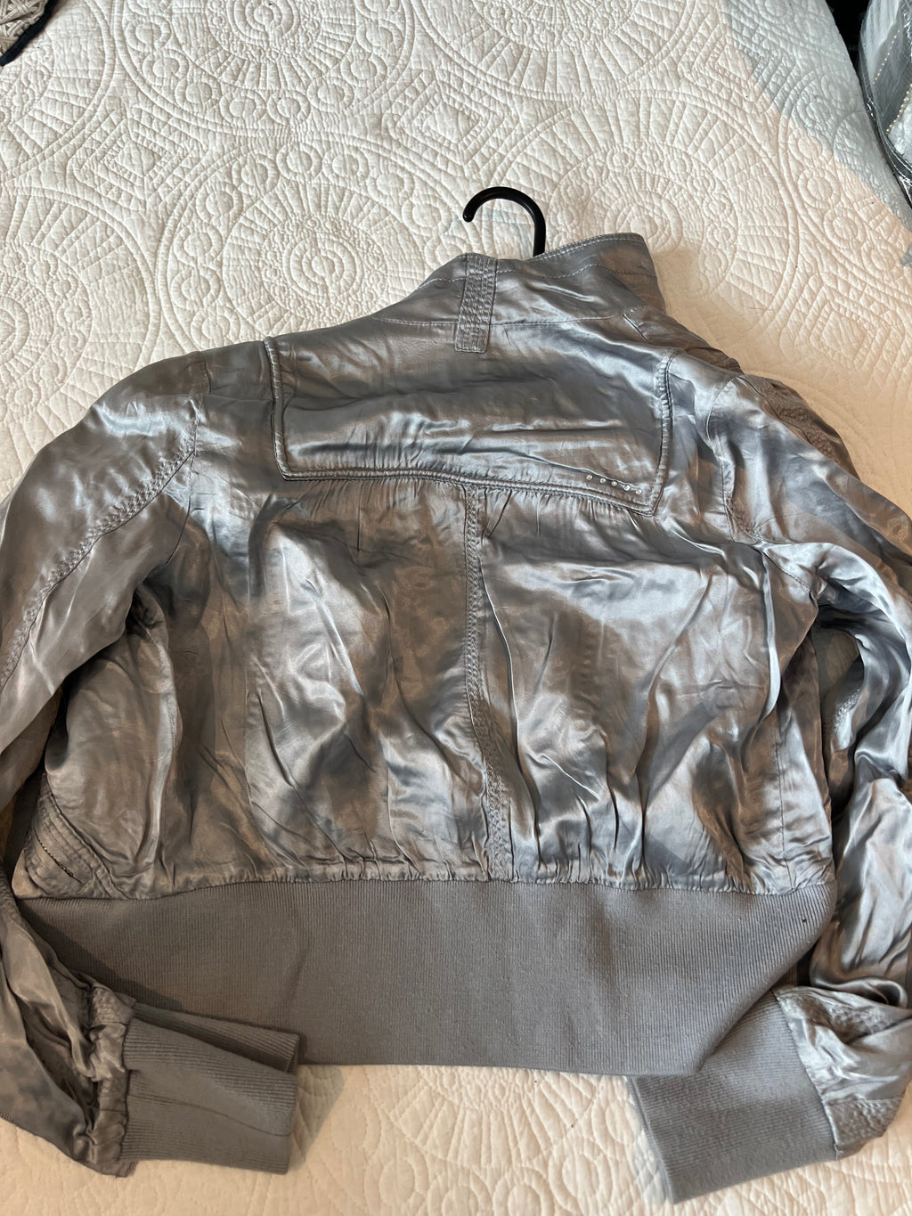 Silver jacket / thin stain effect material