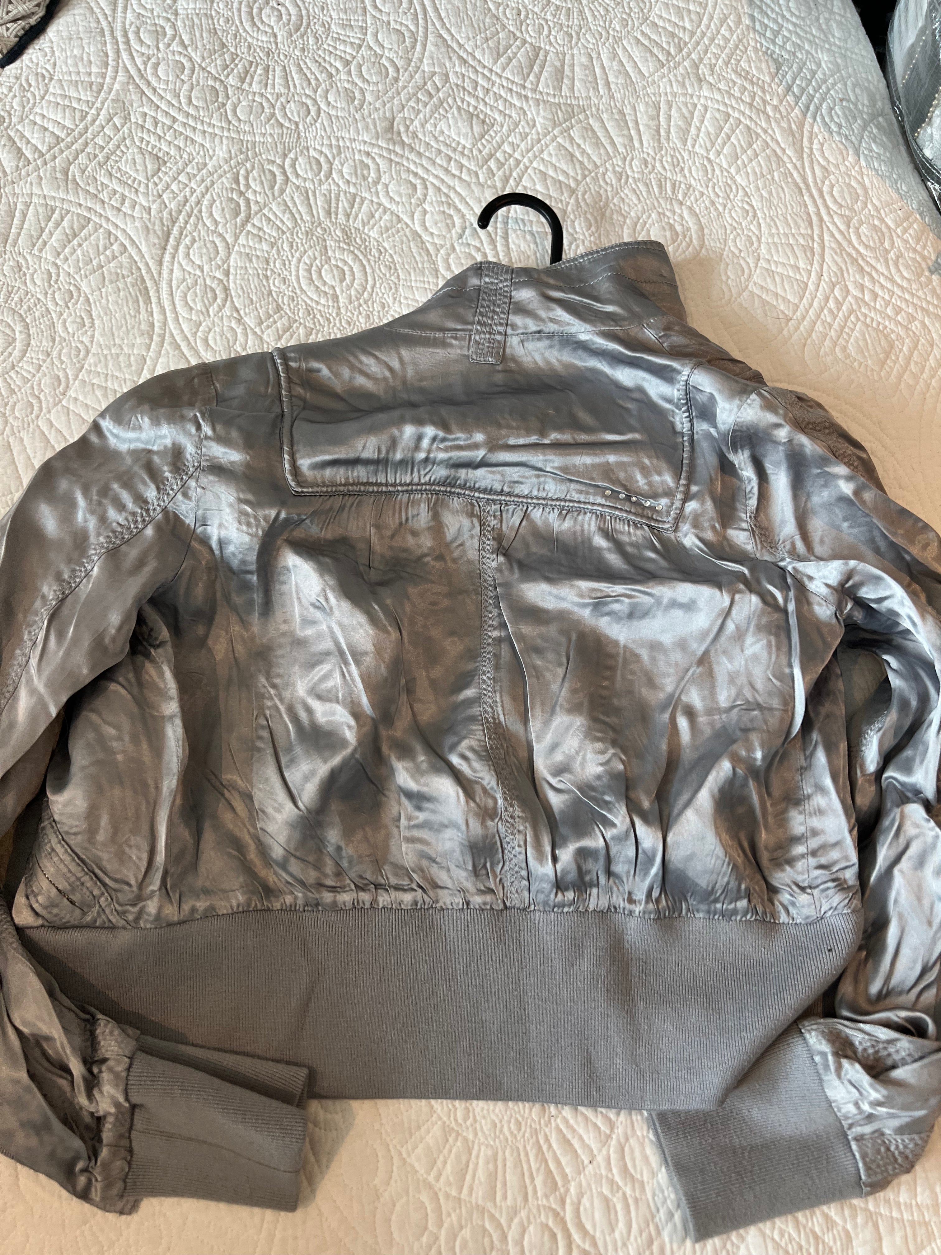 Silver jacket / thin stain effect material
