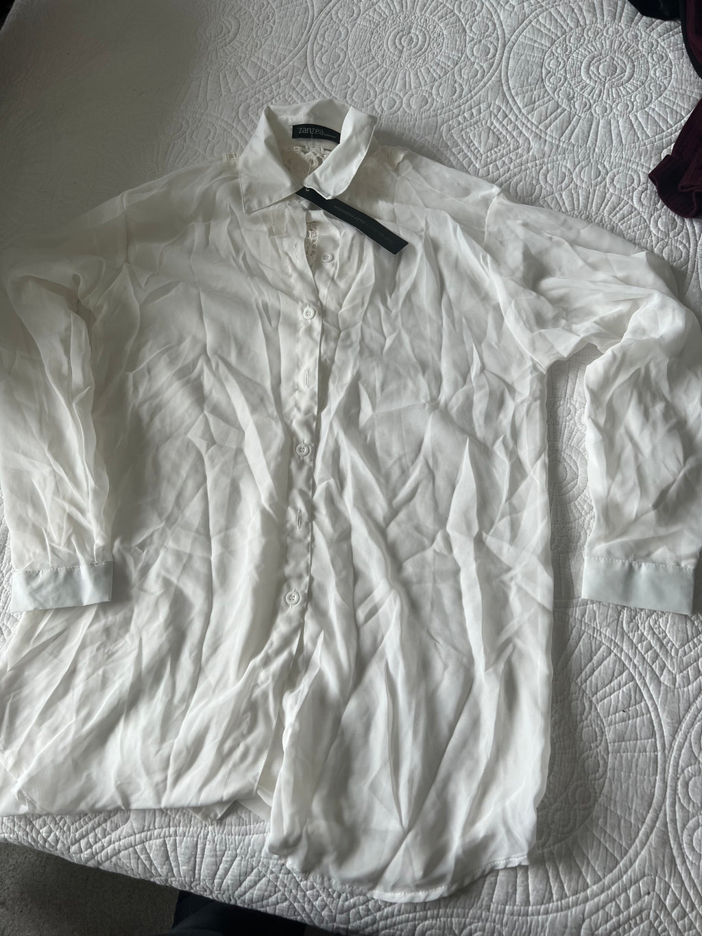 White sheer shirt with lace detail on the back