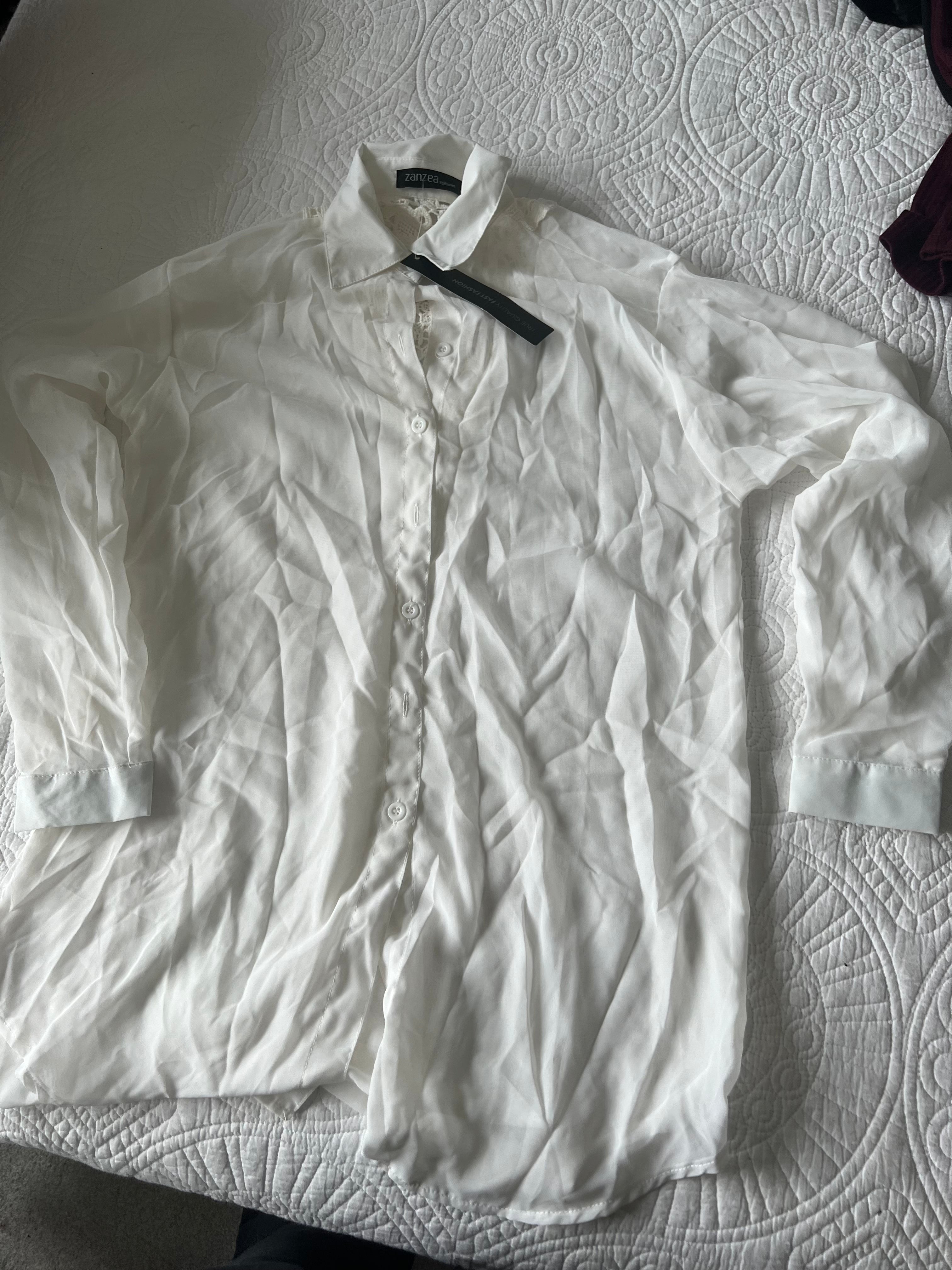 White sheer shirt with lace detail on the back