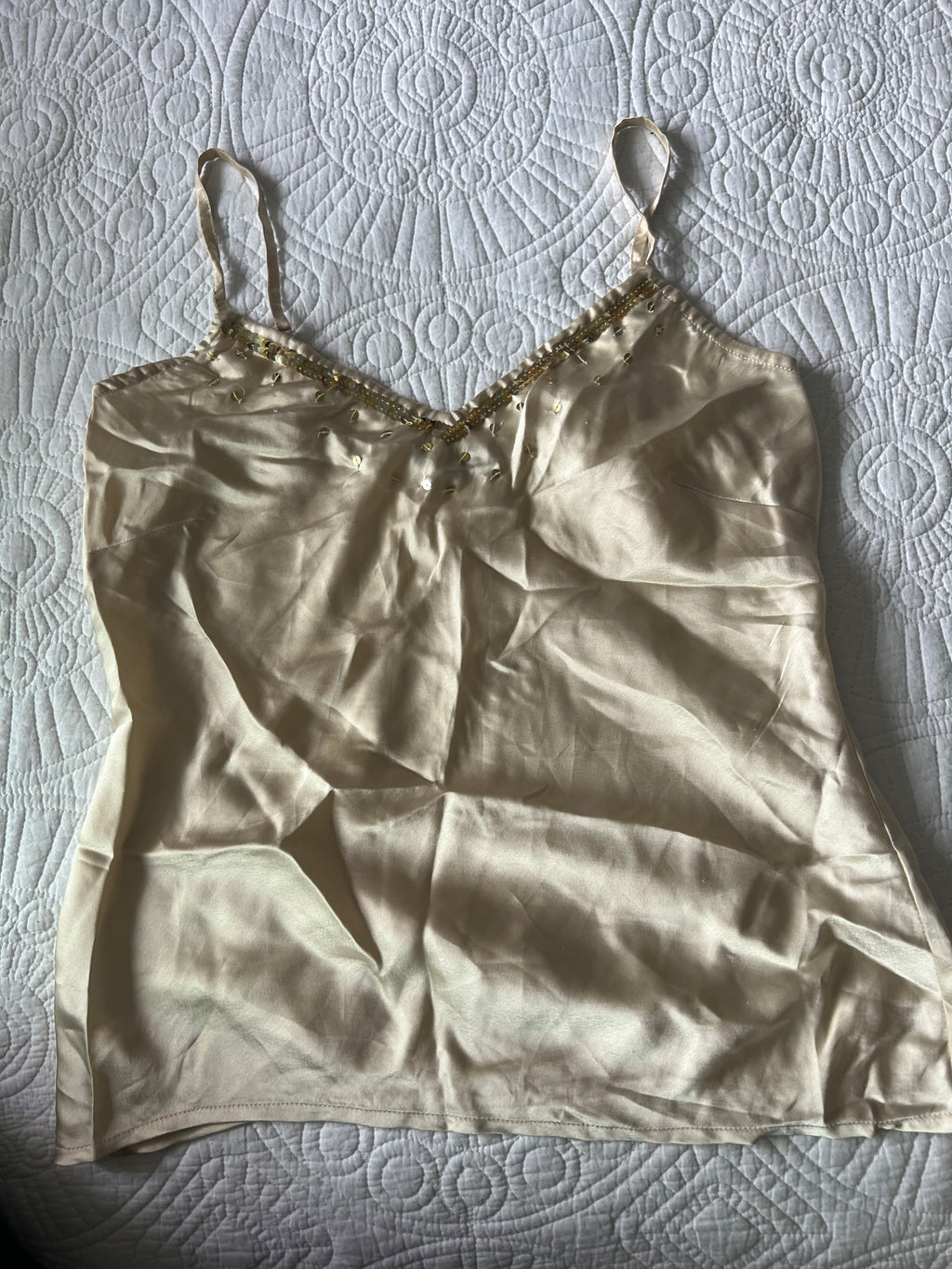 Cream Satin like top with spaghetti straps and gold sequences