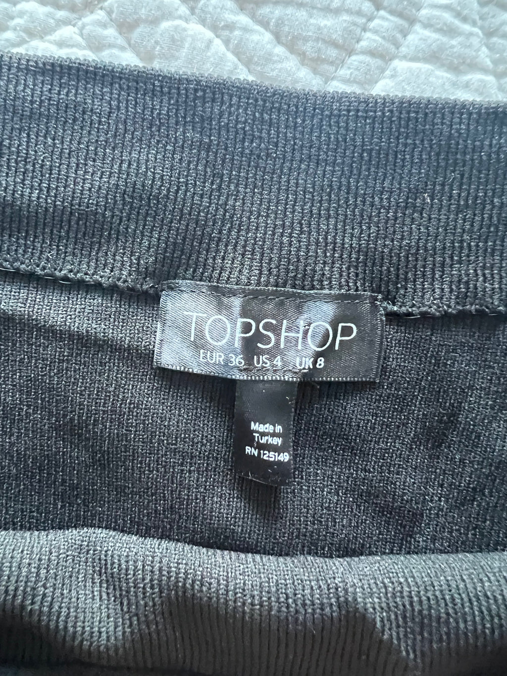Black crop top with flared sleeves
