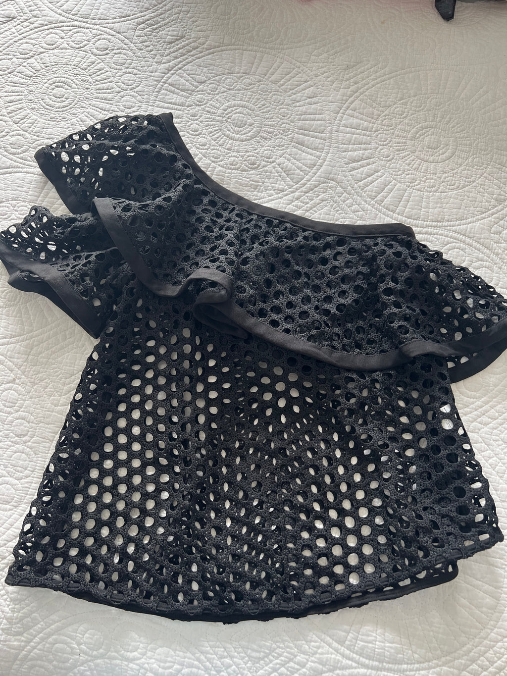 Asymmetrical black top with holes