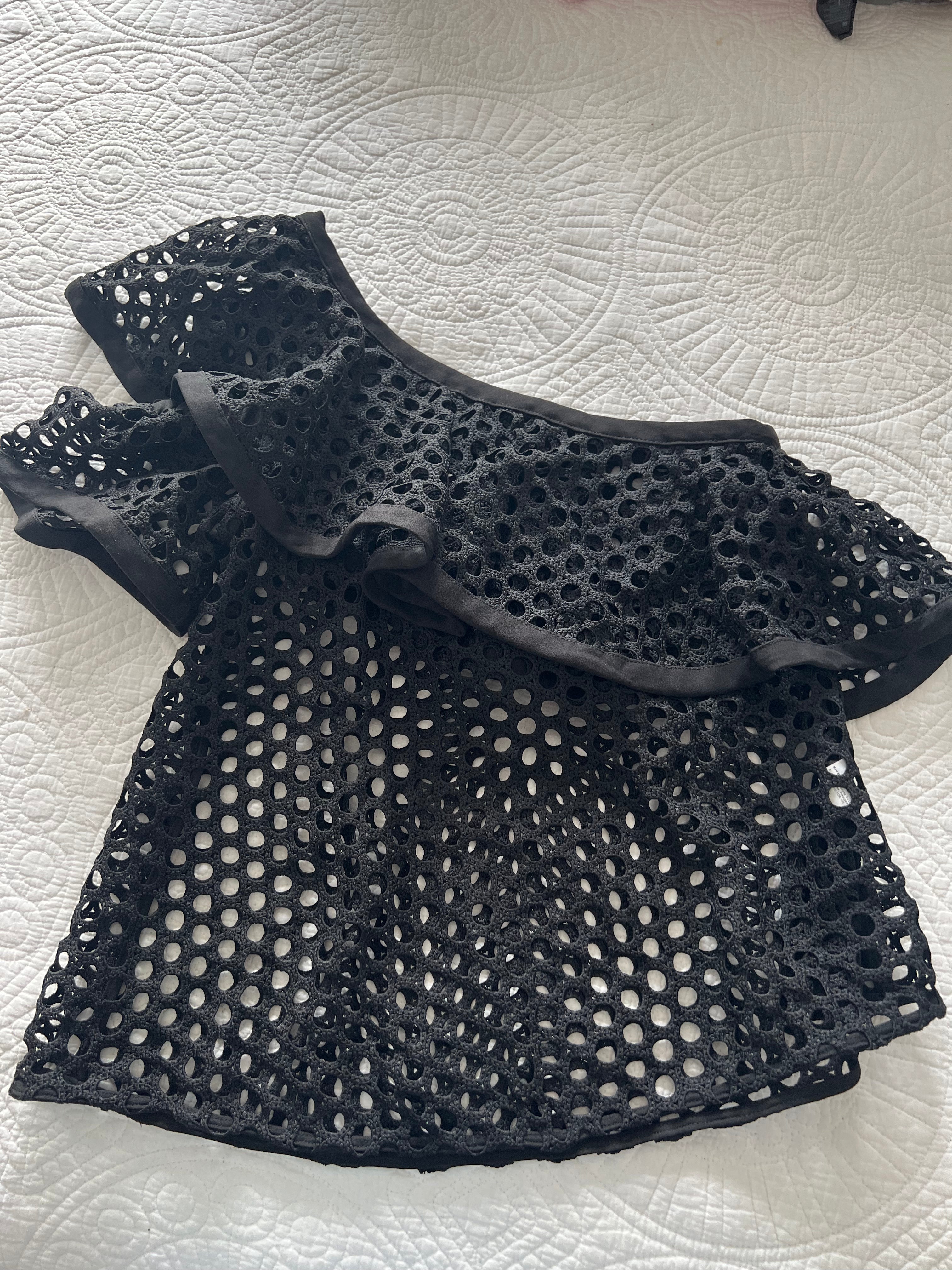 Asymmetrical black top with holes