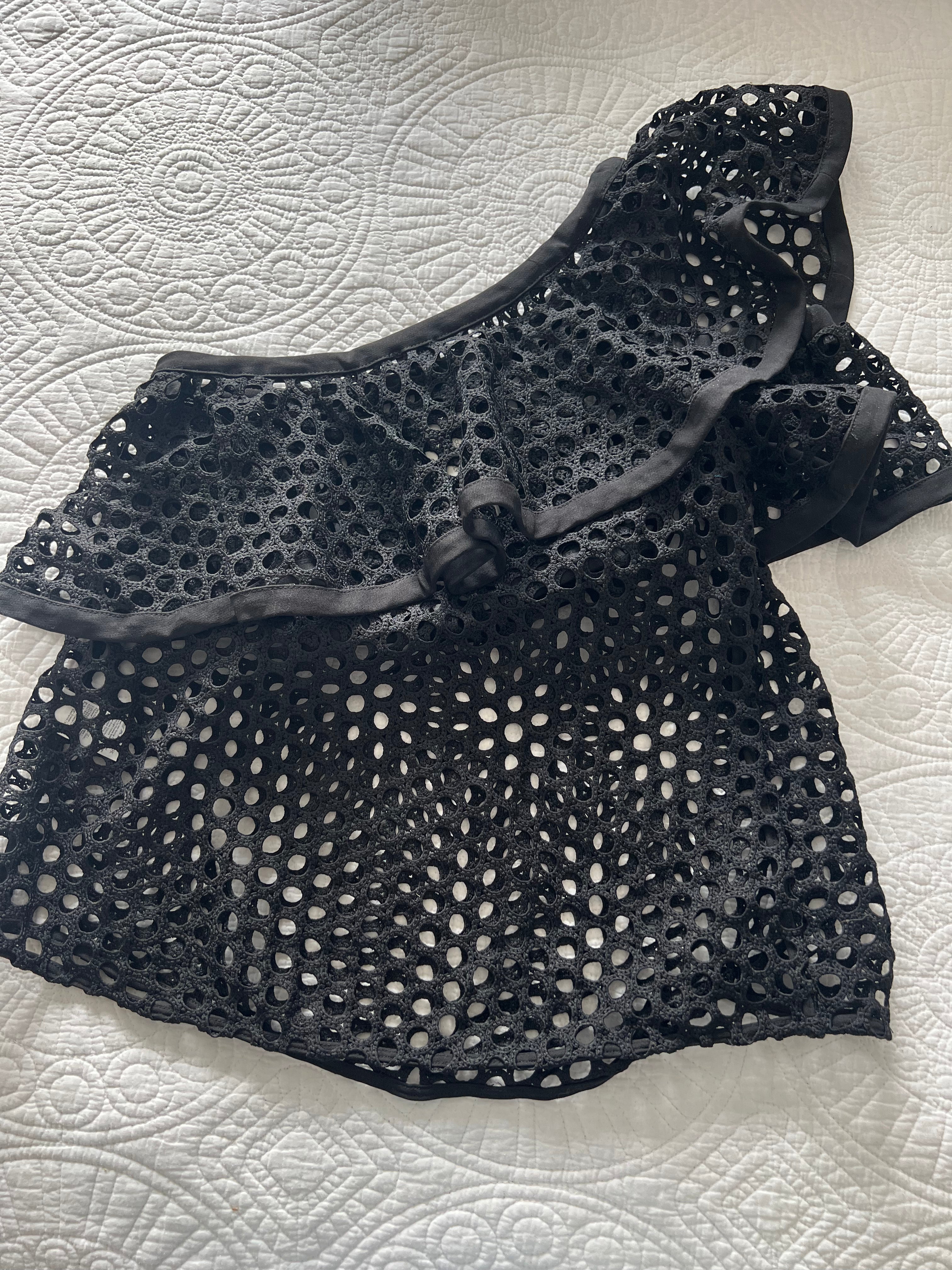 Asymmetrical black top with holes