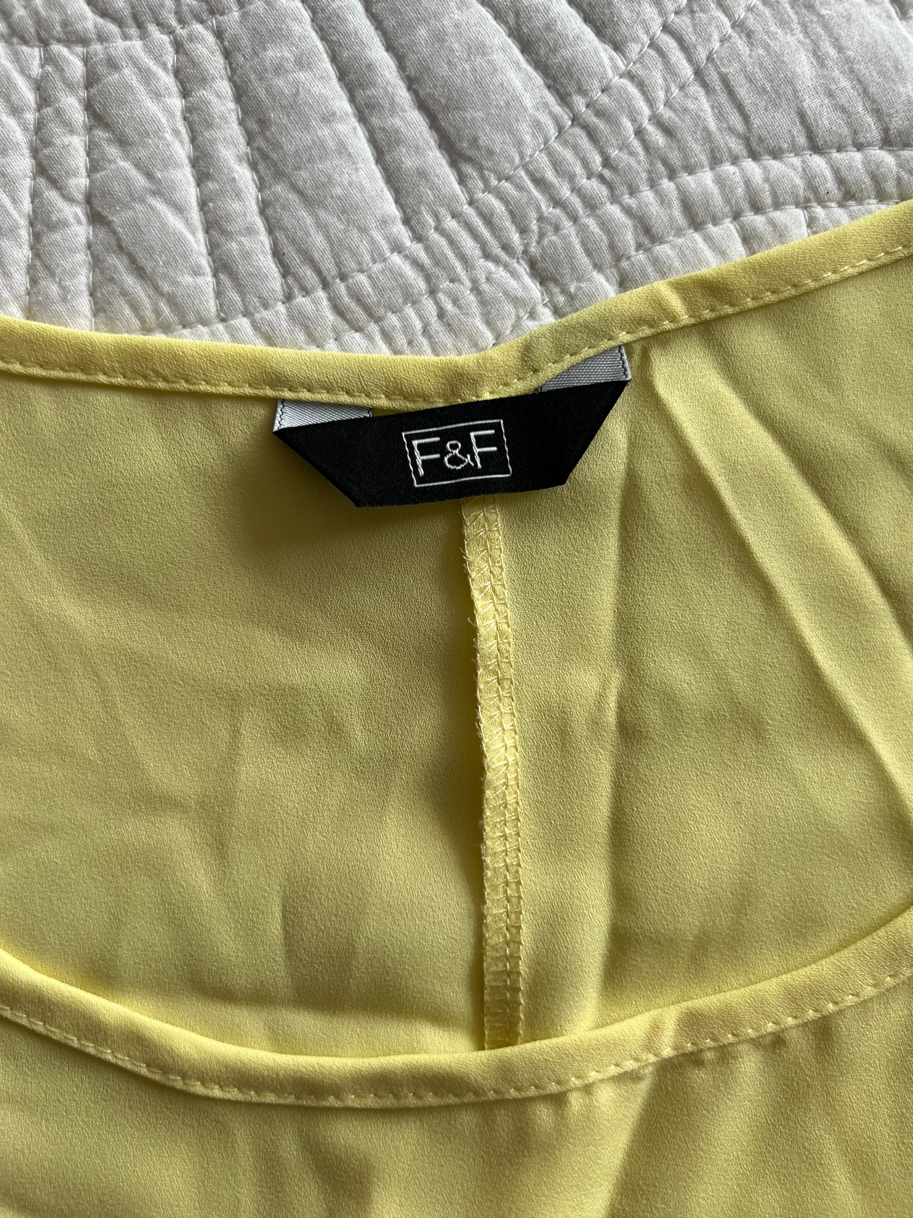 Yellow vest top with long cut out back