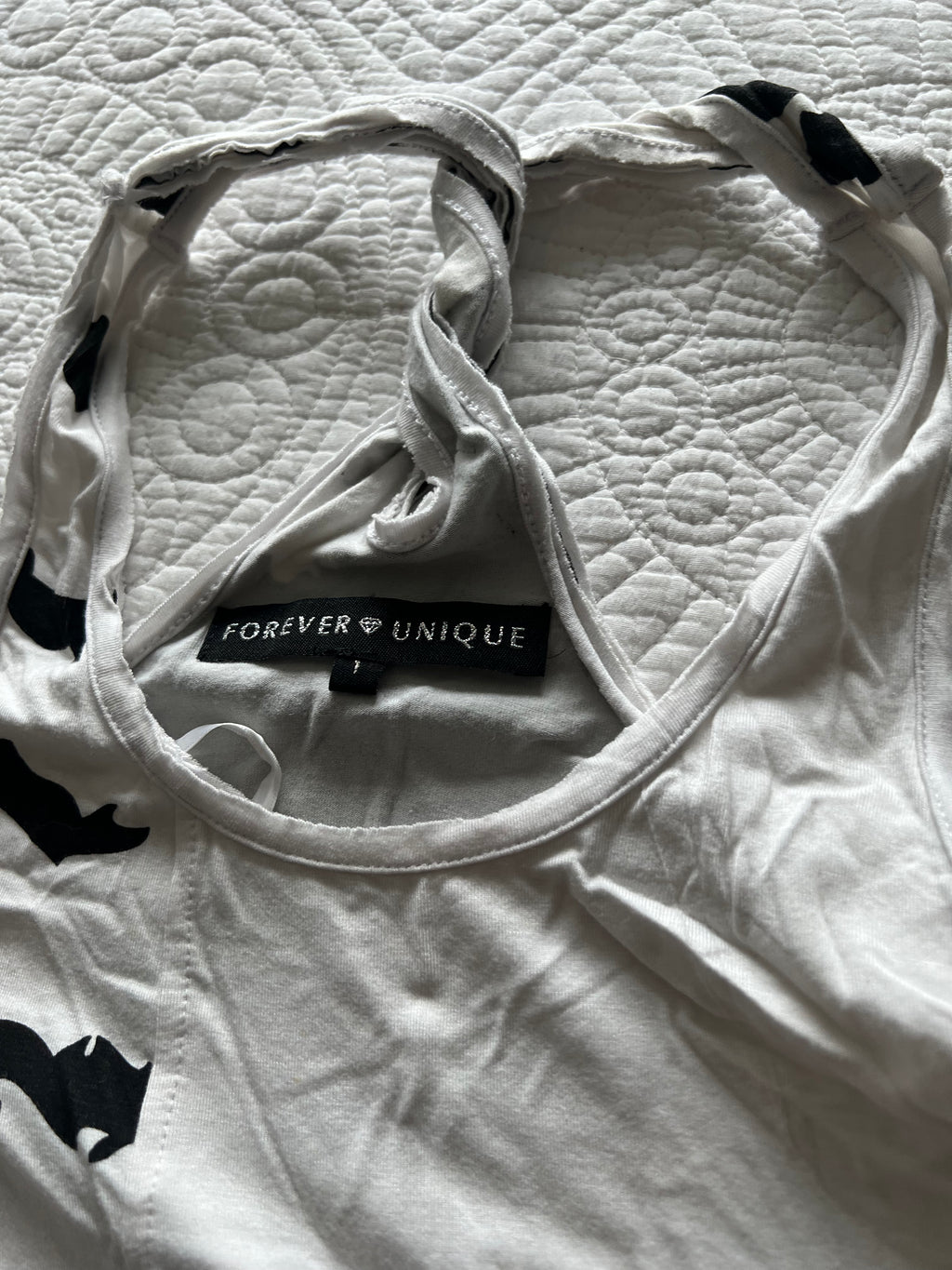 White graphic vest