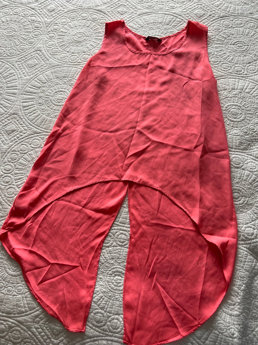 Pink flowy vest with long, cut out back