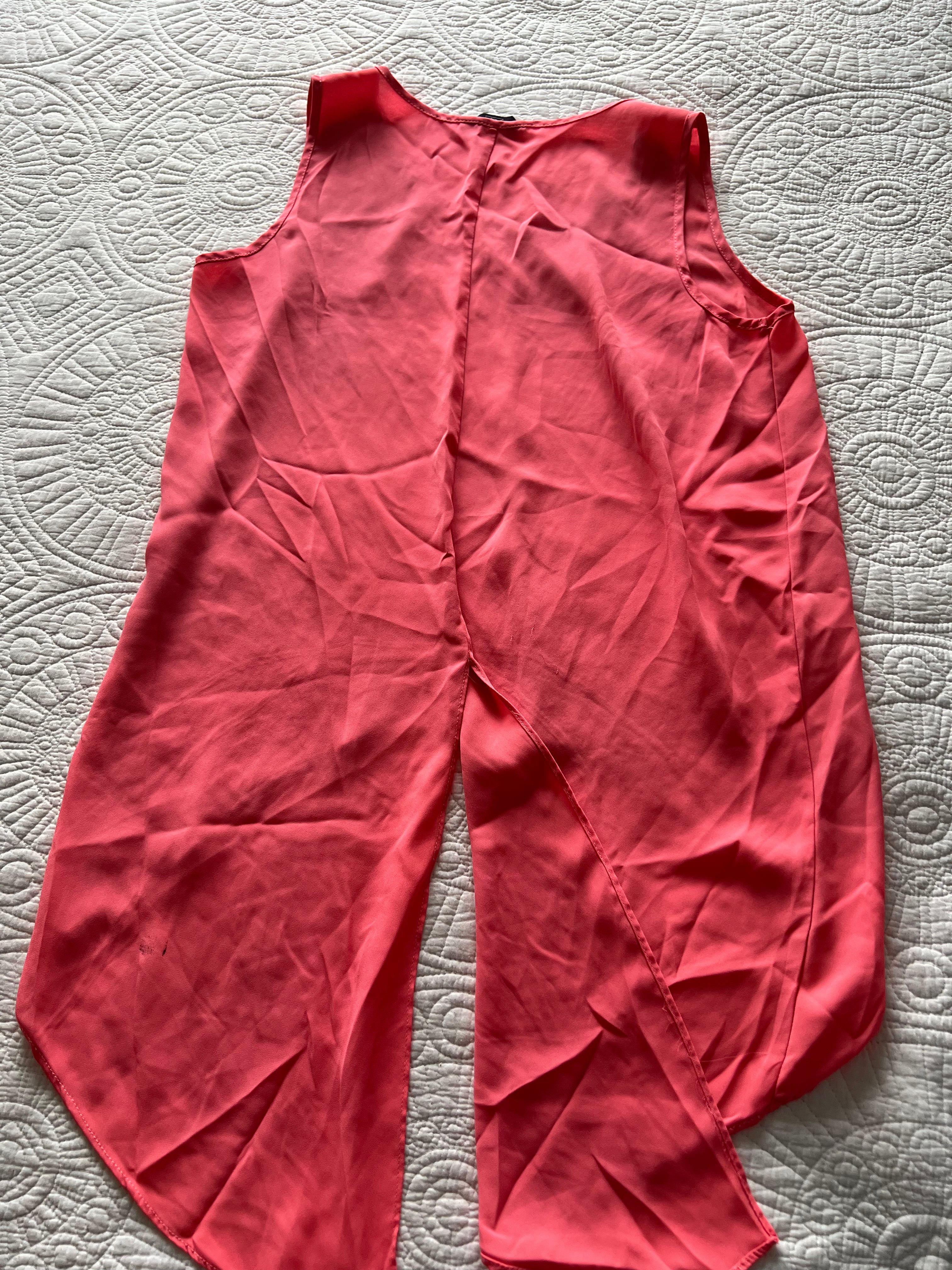 Pink flowy vest with long, cut out back