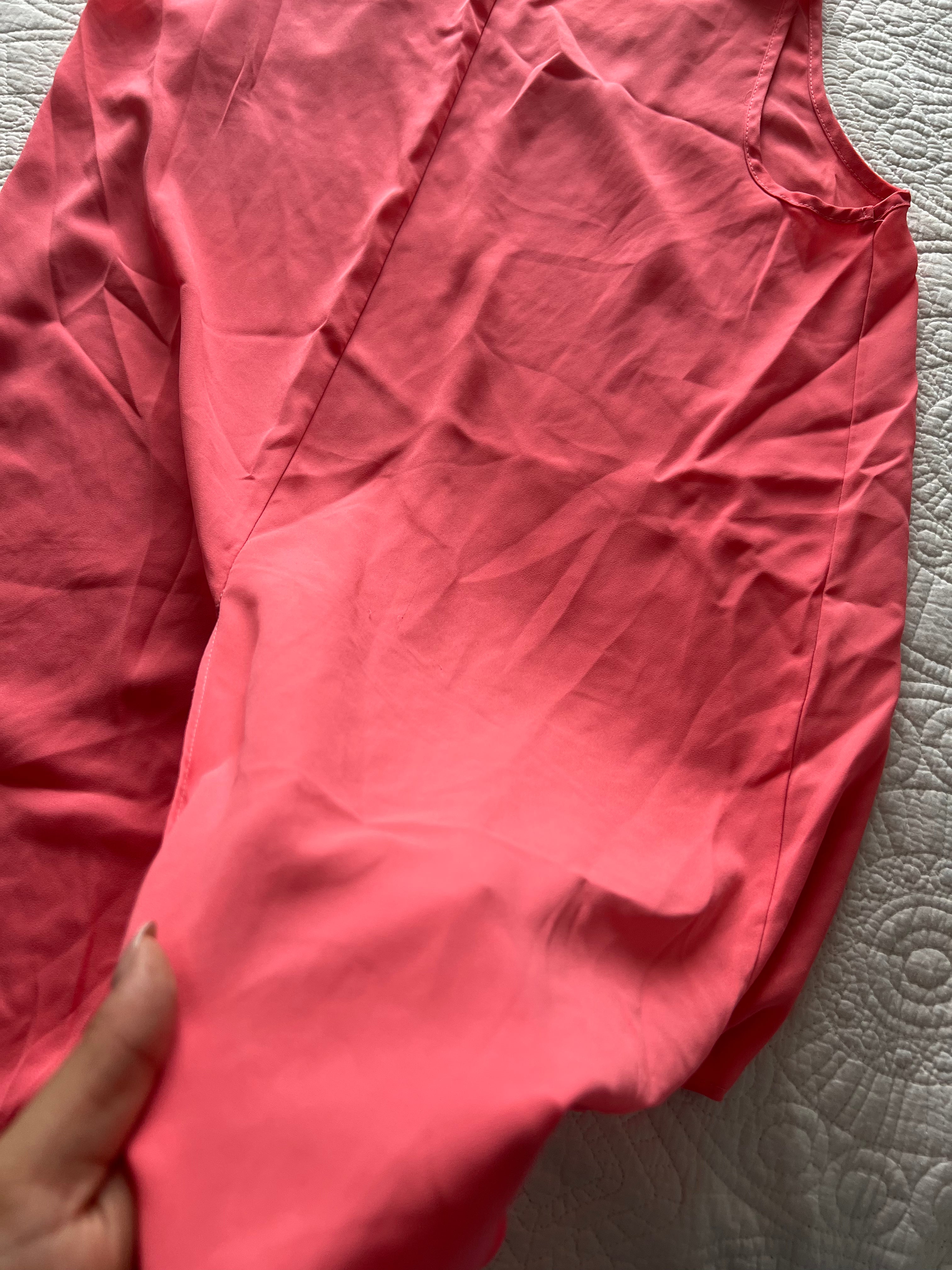 Pink flowy vest with long, cut out back