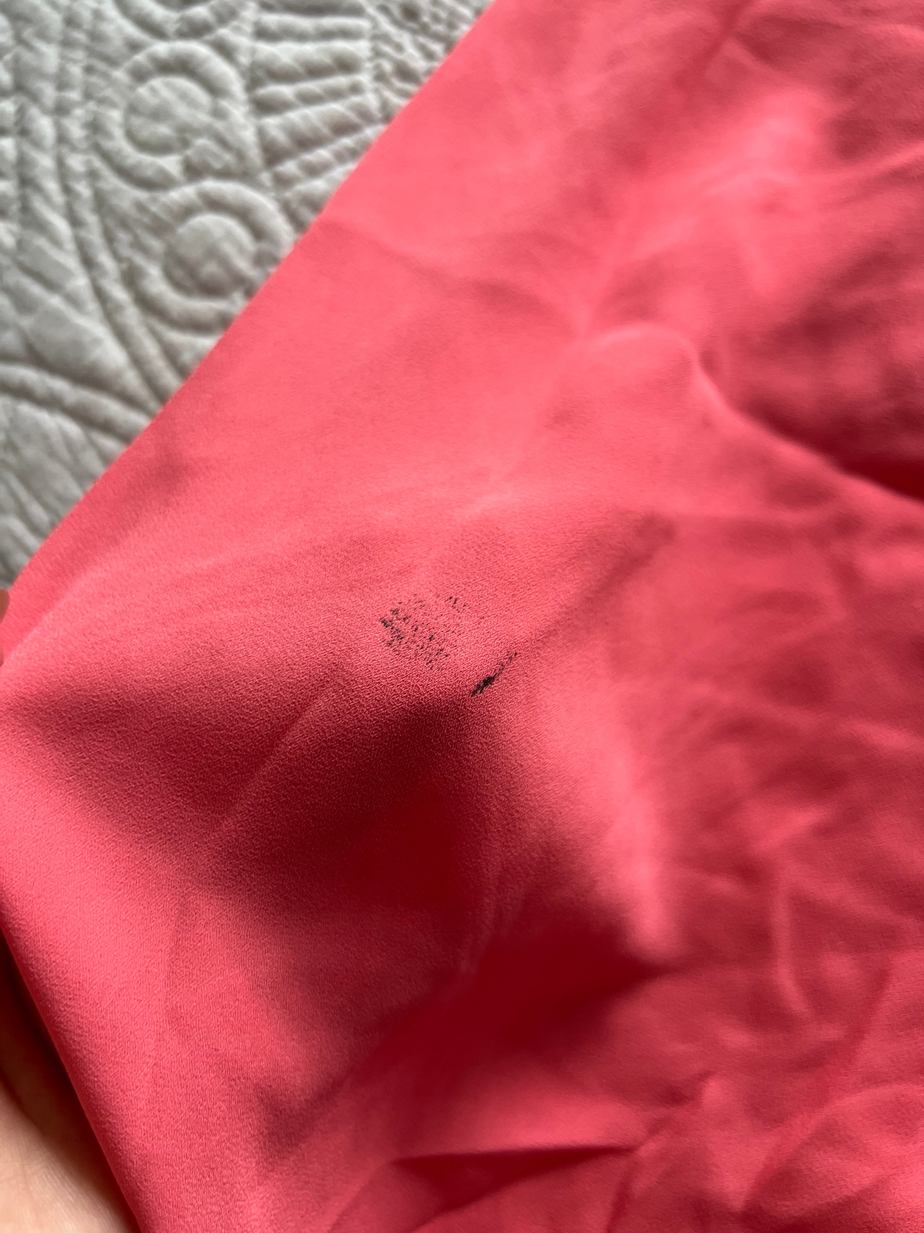 Pink flowy vest with long, cut out back