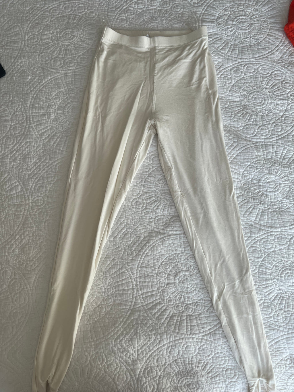 Cream stirrup loop leggings
