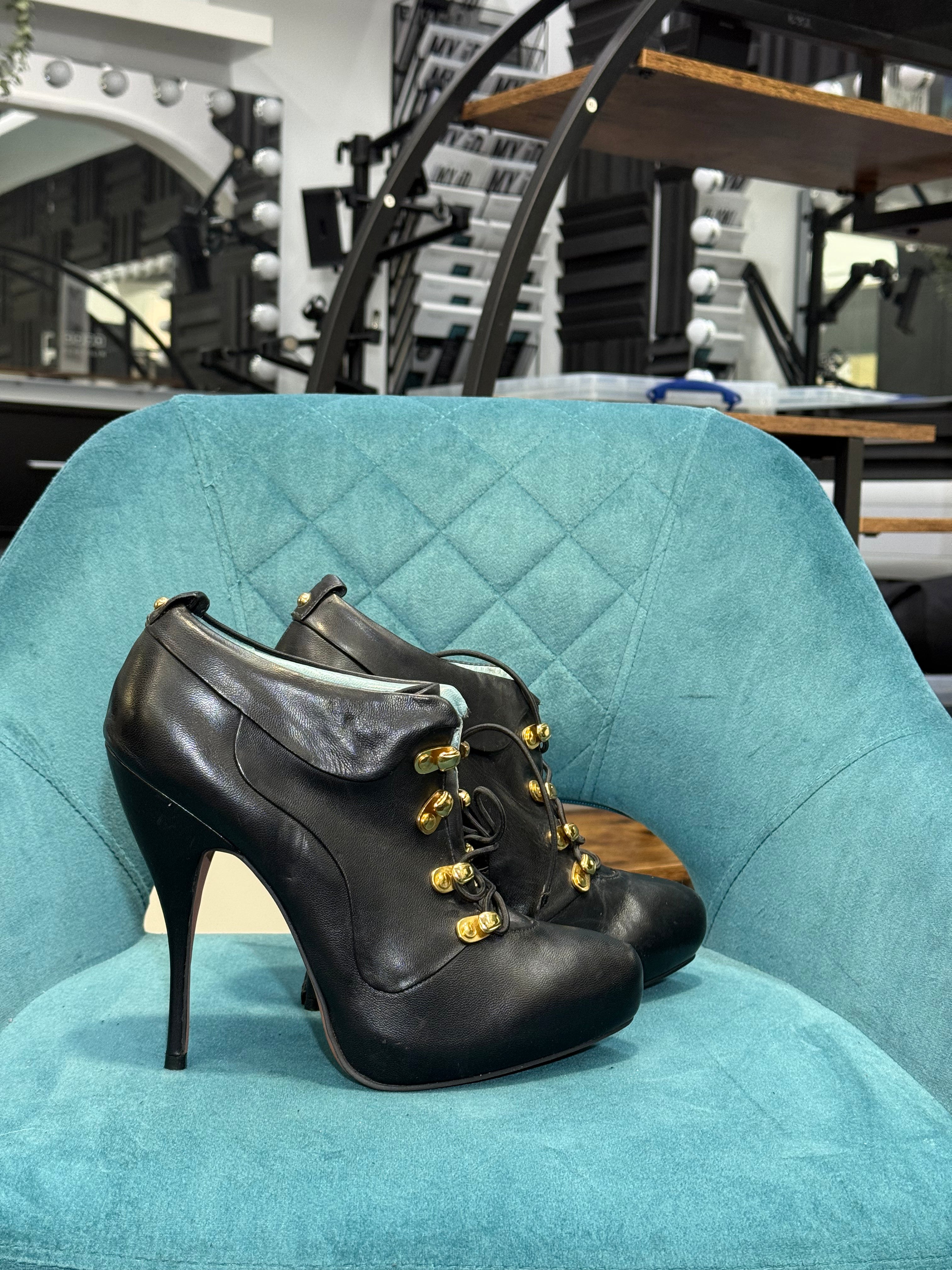 Black Leather Lace-Up Stiletto Ankle Boots with Gold Hardware