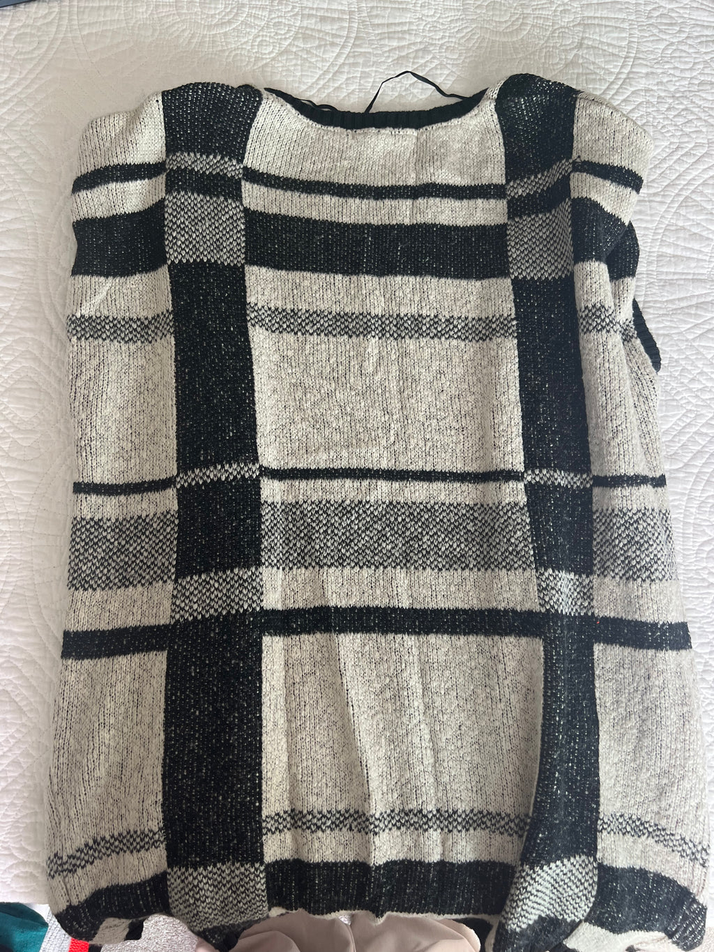 Grey sleeveless knitted cardigan