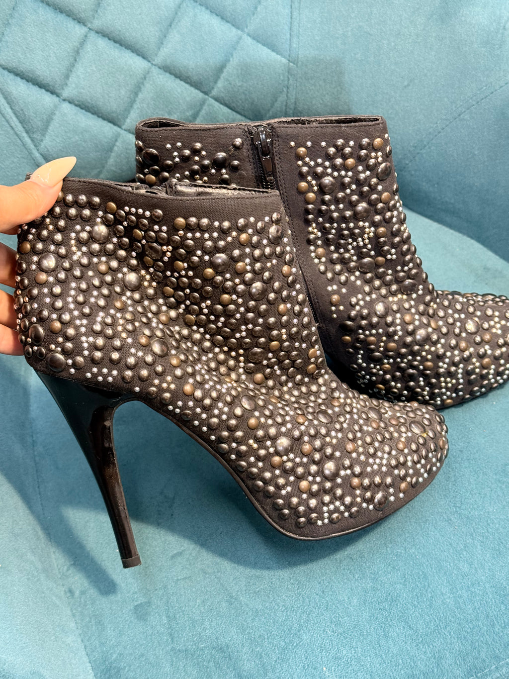 Black ankle heels with silver embellishments