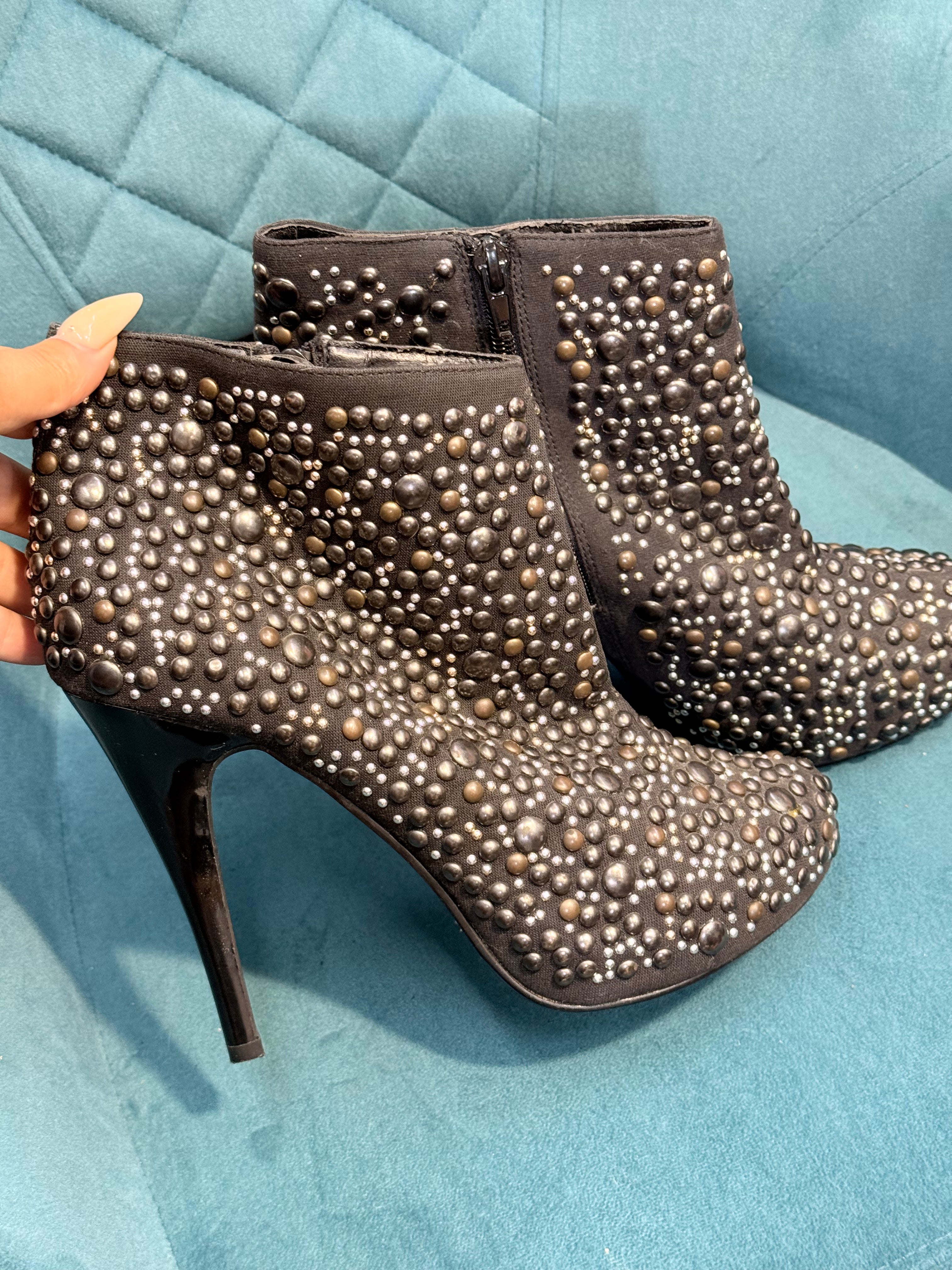 Black ankle heels with silver embellishments