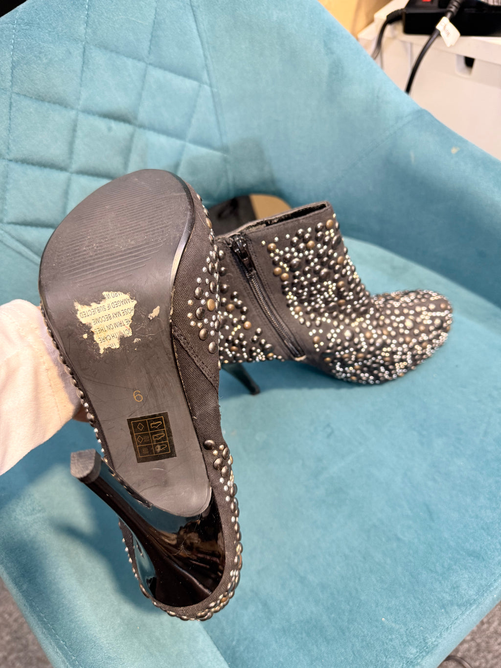 Black ankle heels with silver embellishments