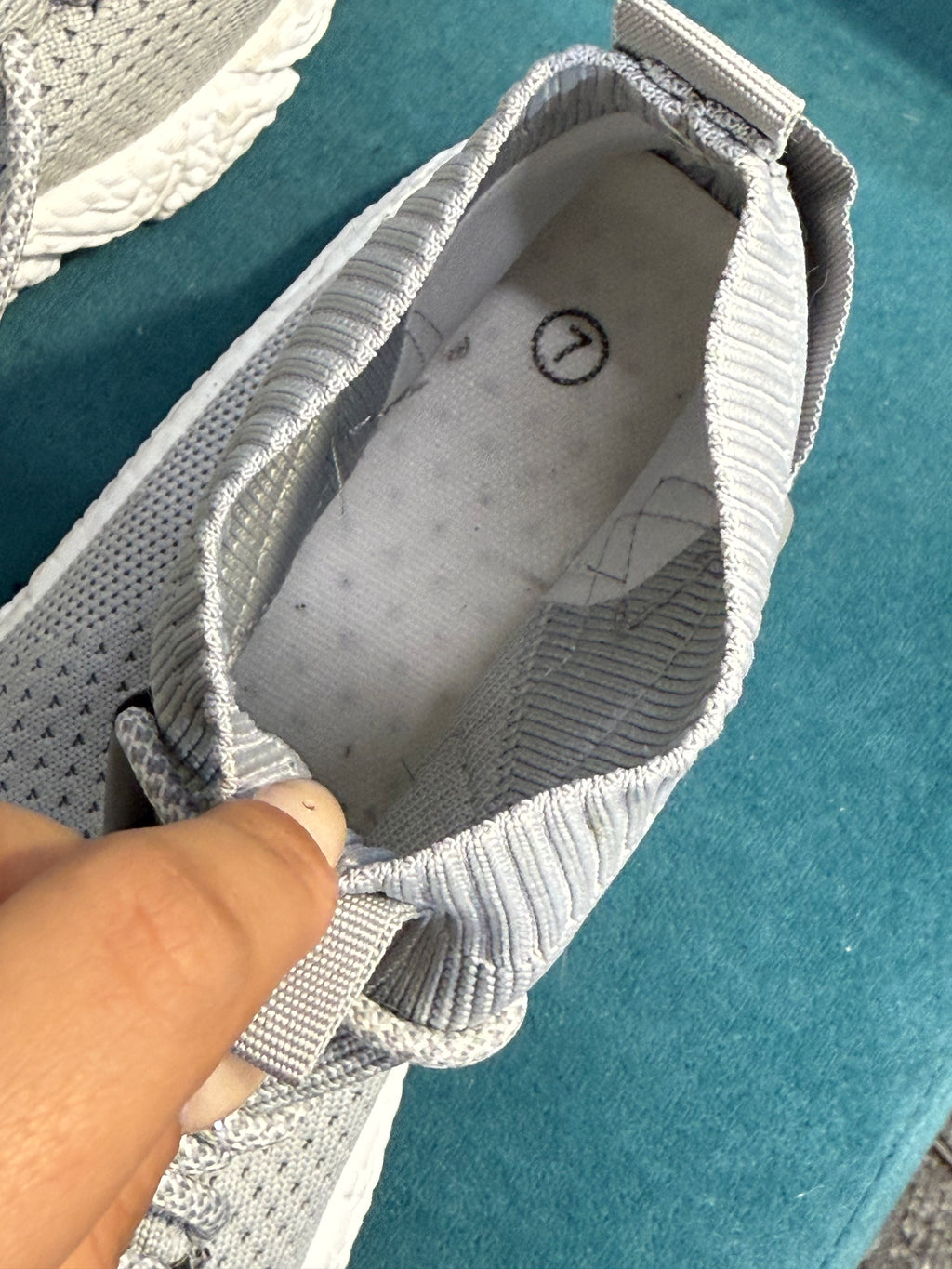Grey trainers with white sole