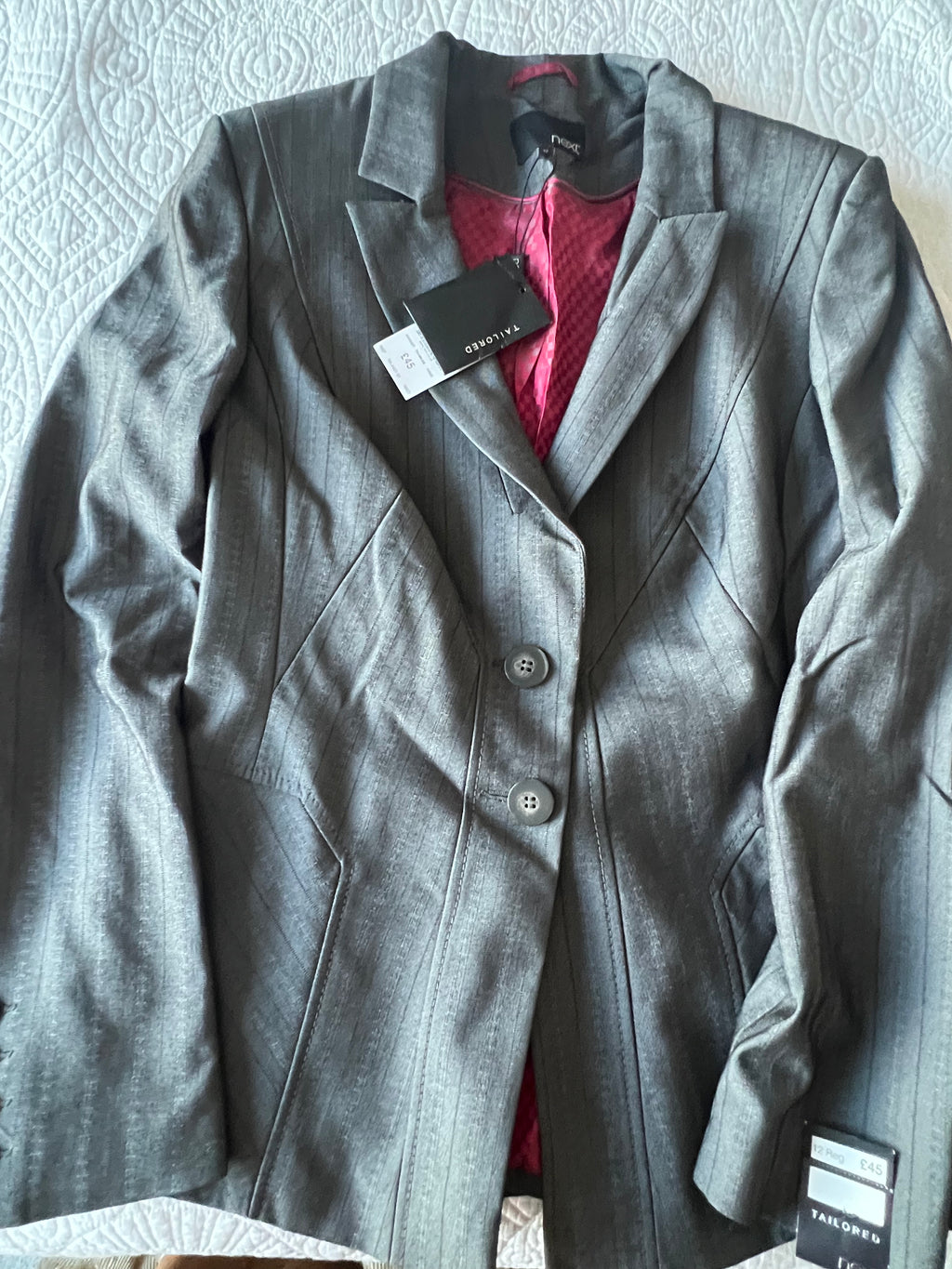 Low waisted grey trousers with matching blazer