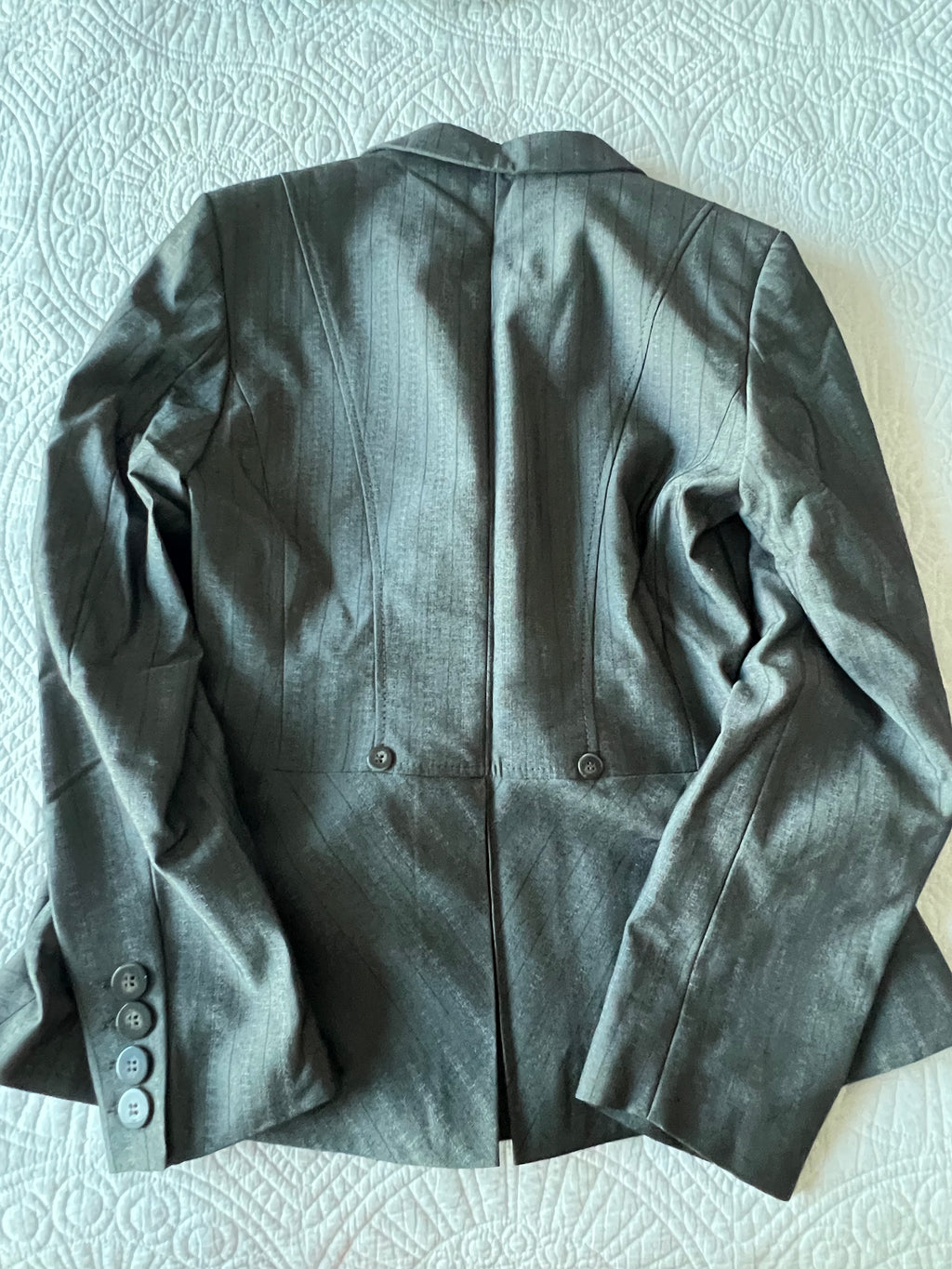 Low waisted grey trousers with matching blazer
