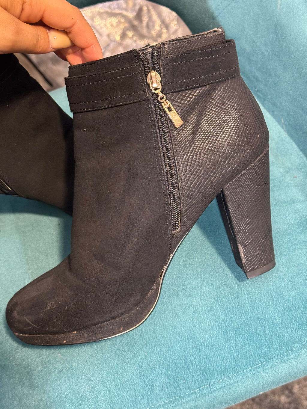 Women’s black heeled ankle boots with gold button detail