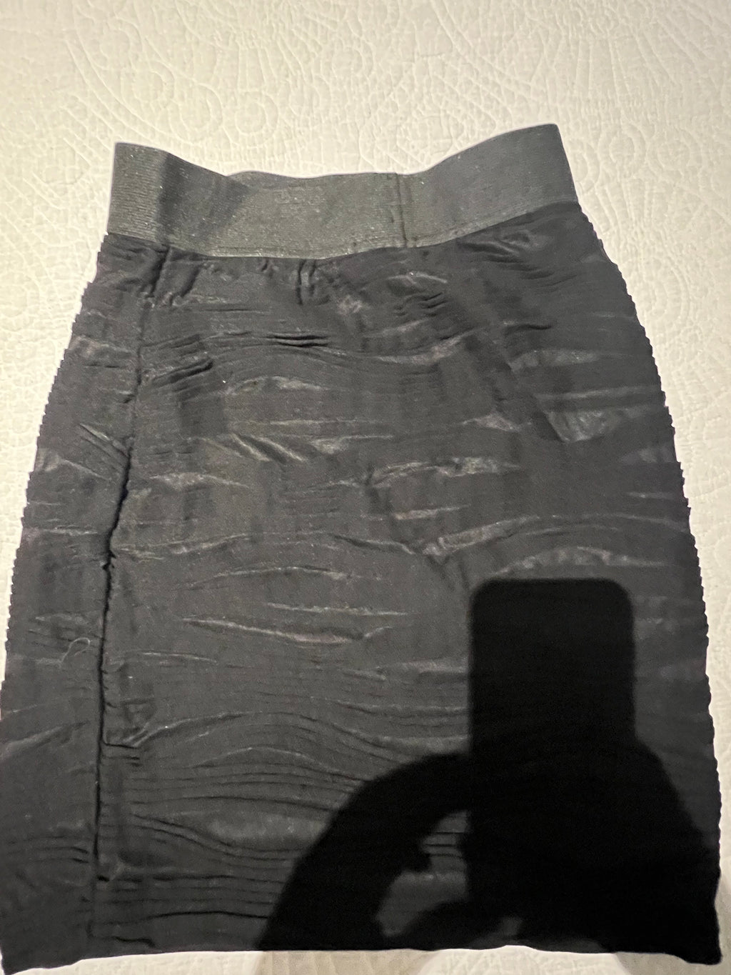 Black textured mini skirt