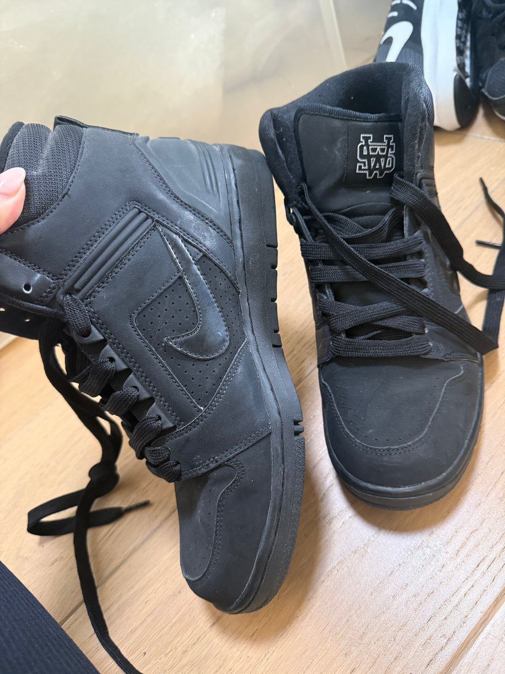 High top black Nike trainers