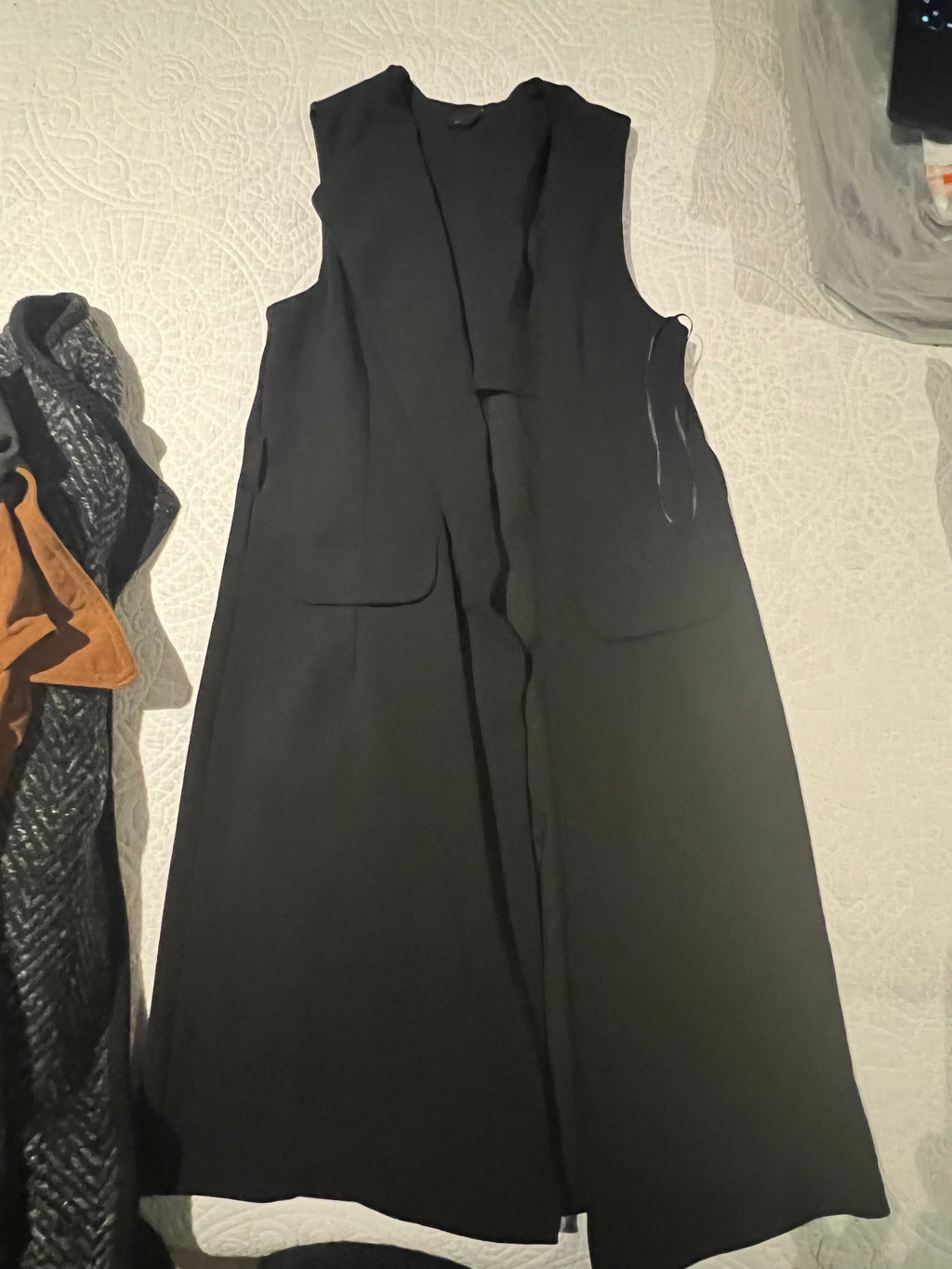 Black sleeveless jacket