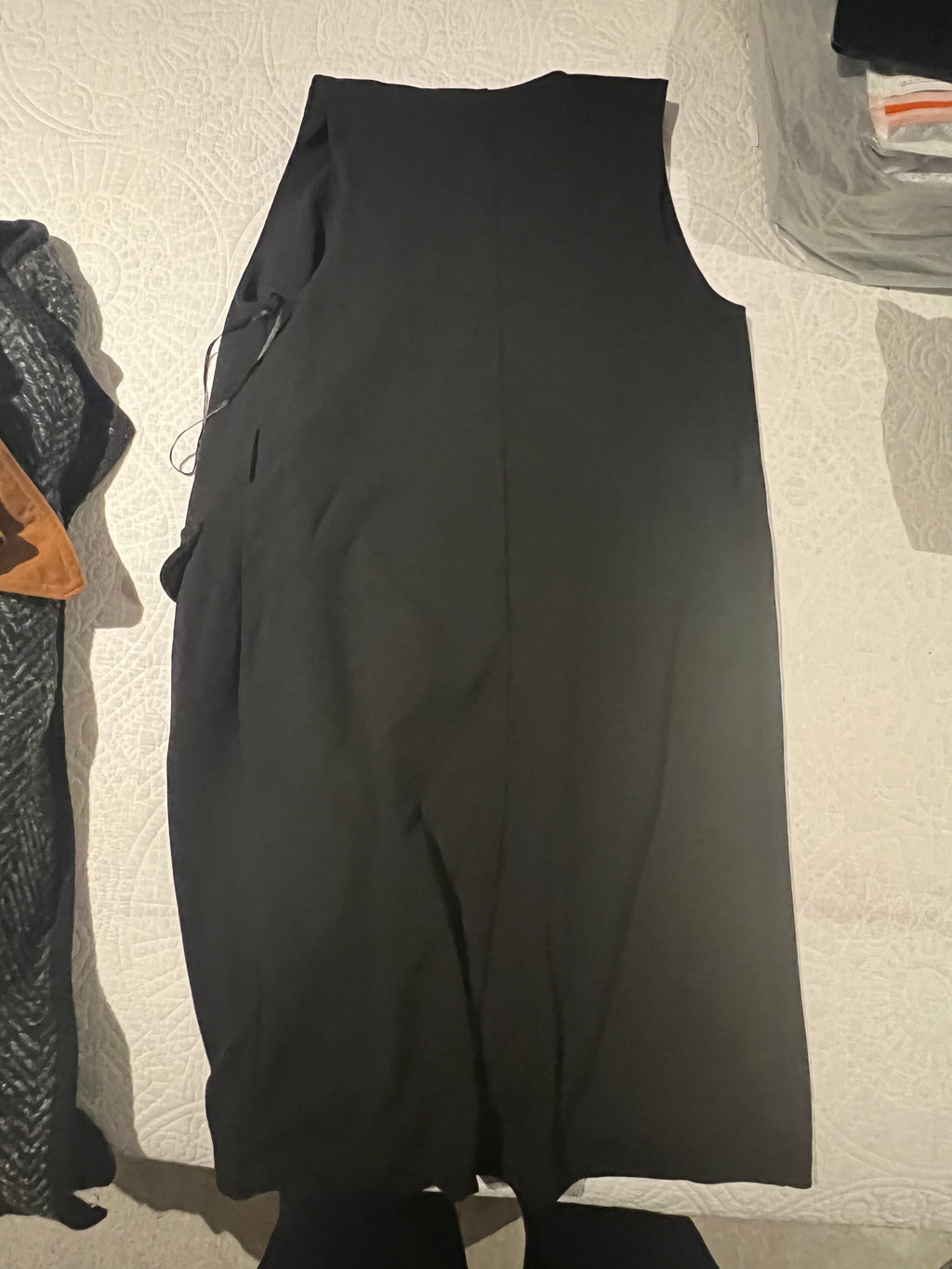 Black sleeveless jacket