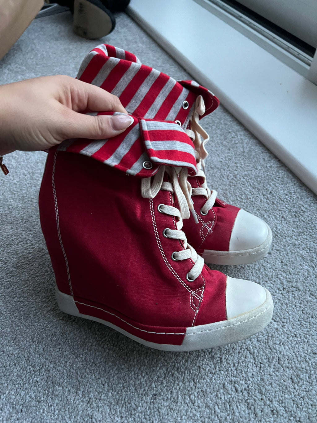 Red wedge trainers