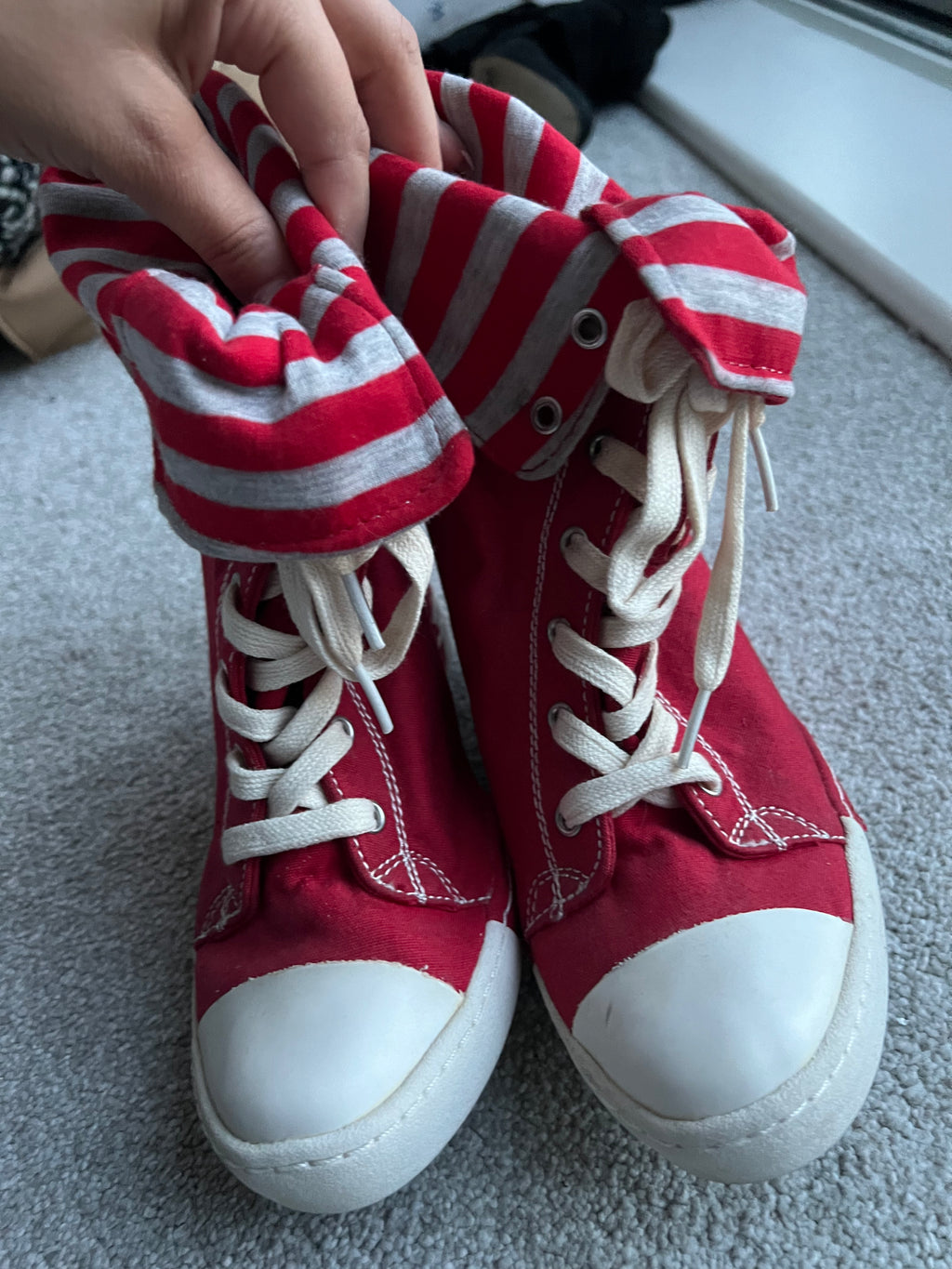Red wedge trainers