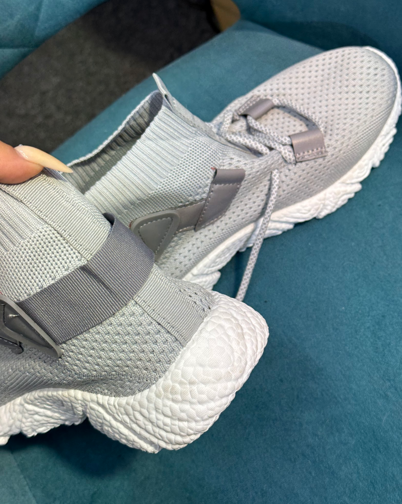 Grey trainers with white sole